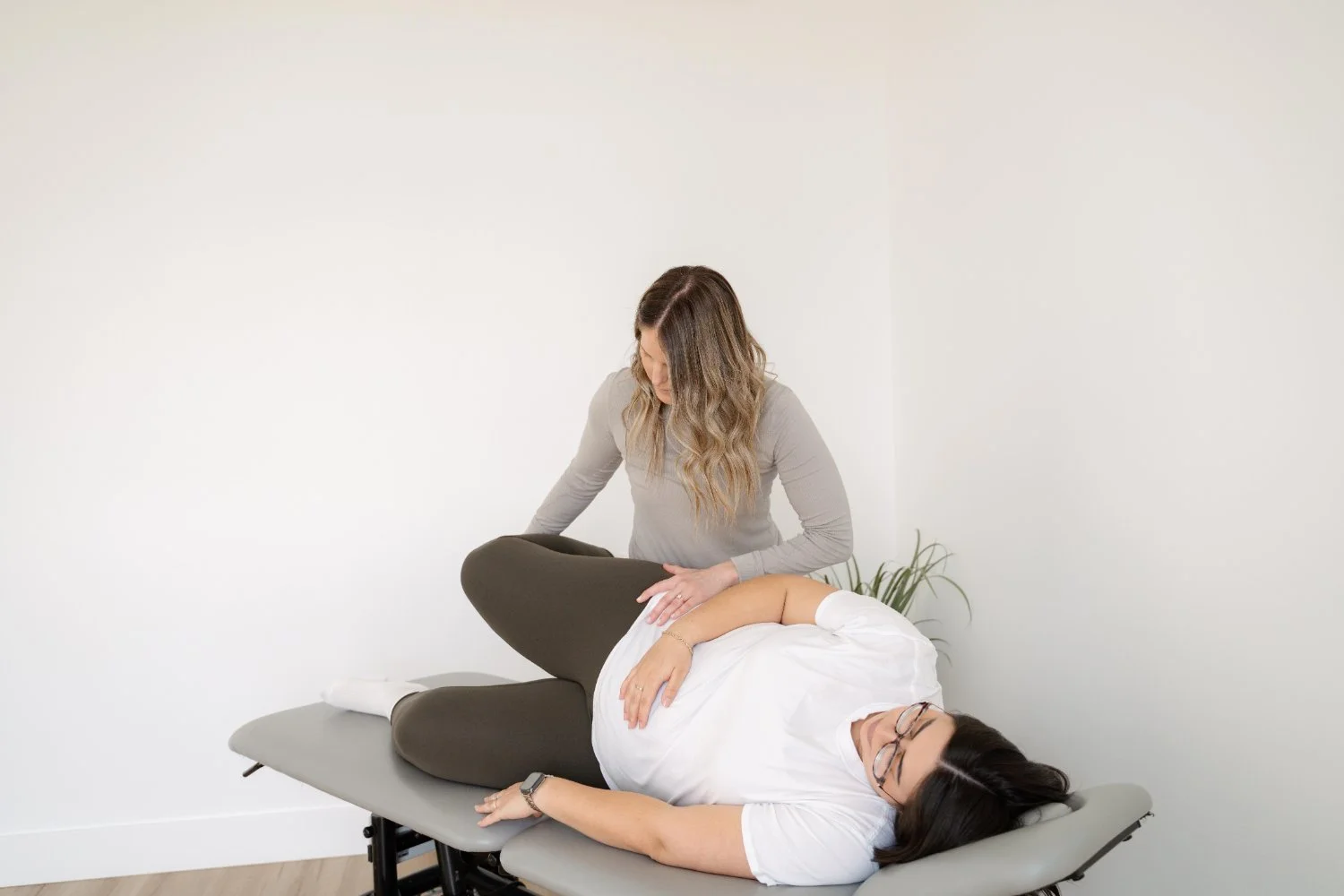 Chiropractor performing a side-lying spinal adjustment on a patient at The Wellness Hub in Stoney Creek, Ontario