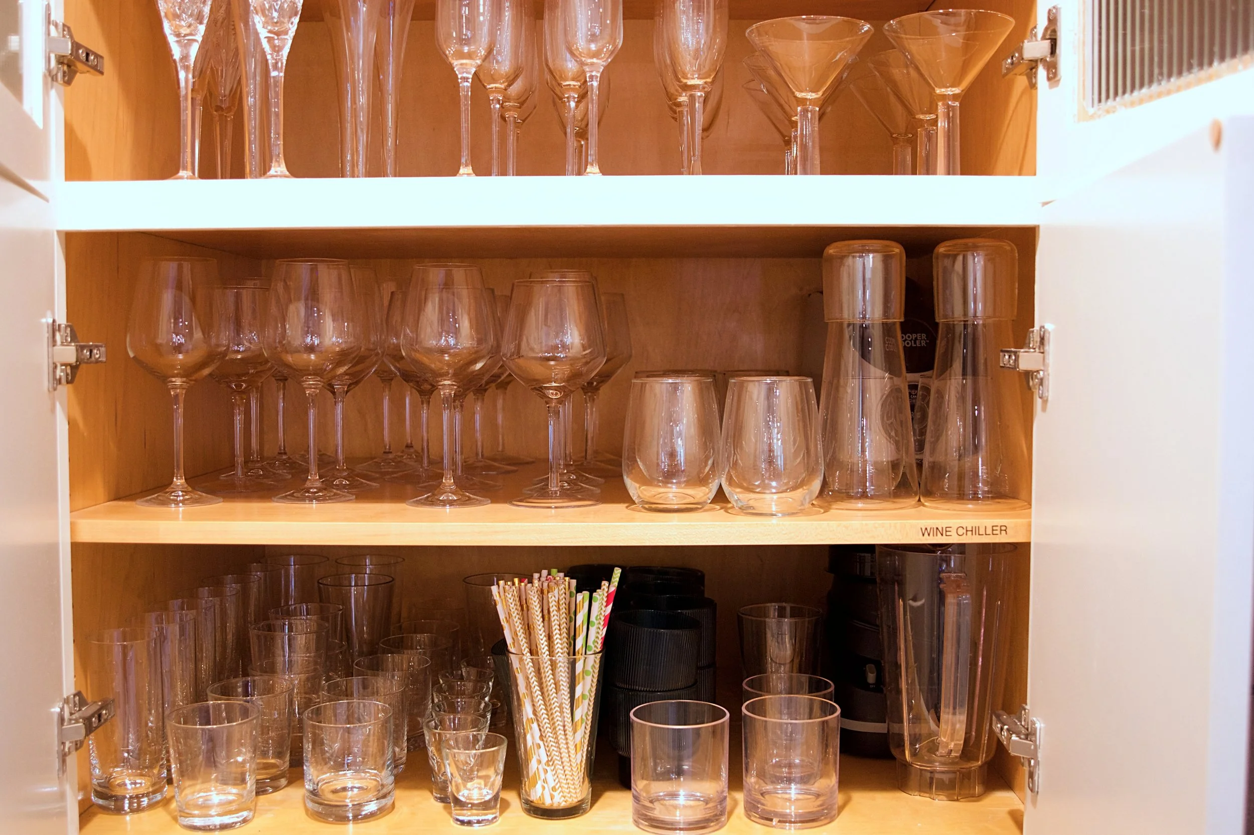 Blender, Wine Chiller and Large Assortment of Glassware.
