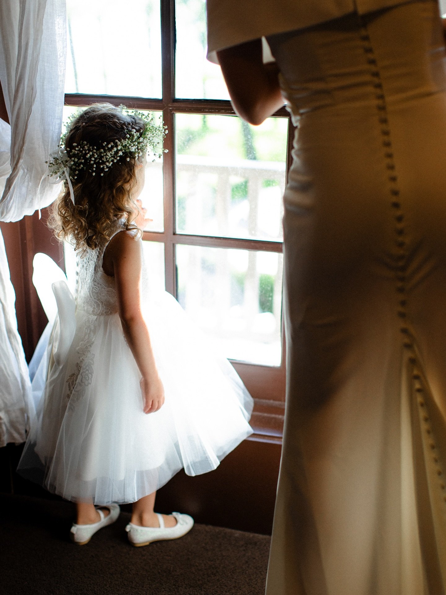 Just before the ceremony, watching through the window as all the guests arrive