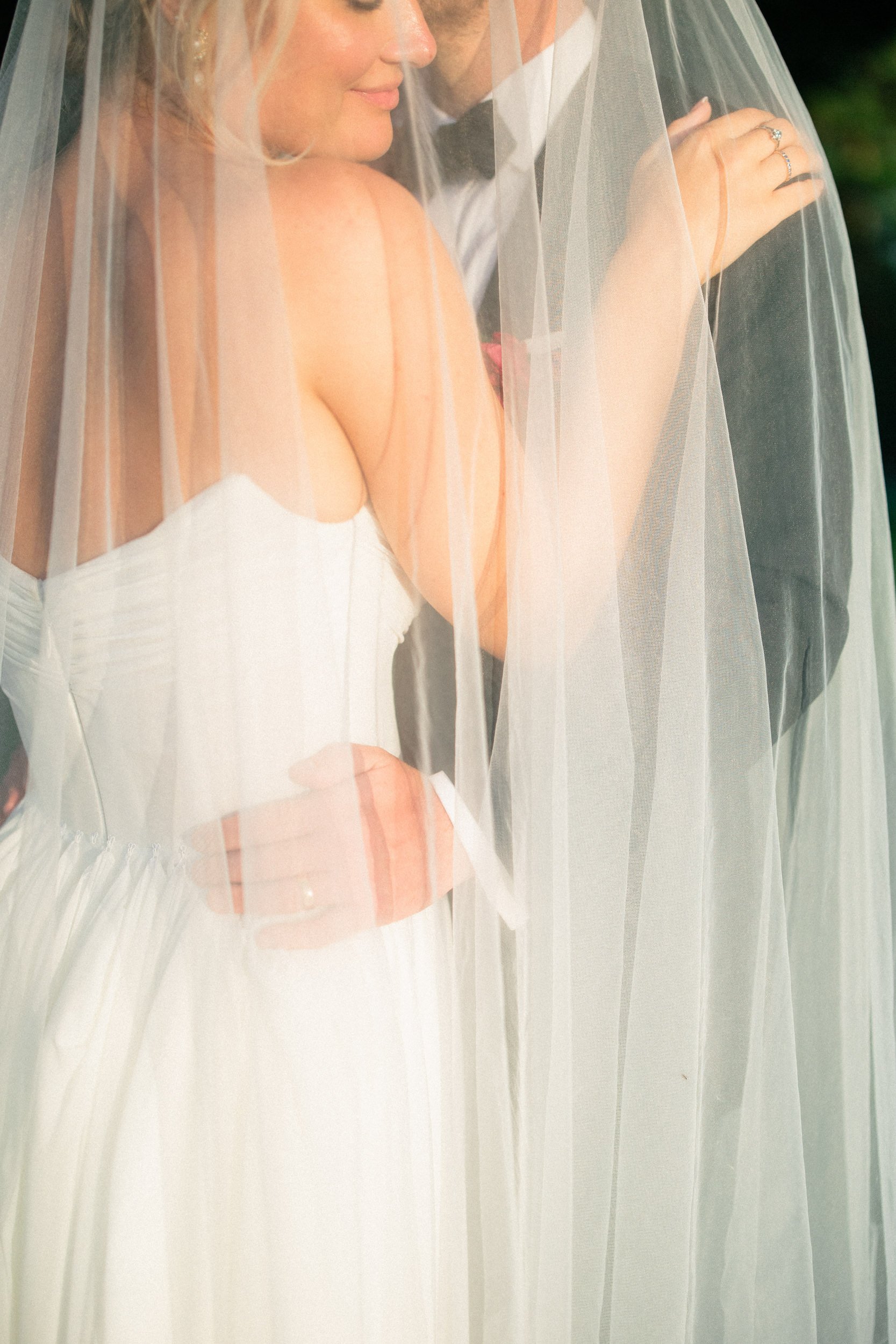 bride and groom veil photo