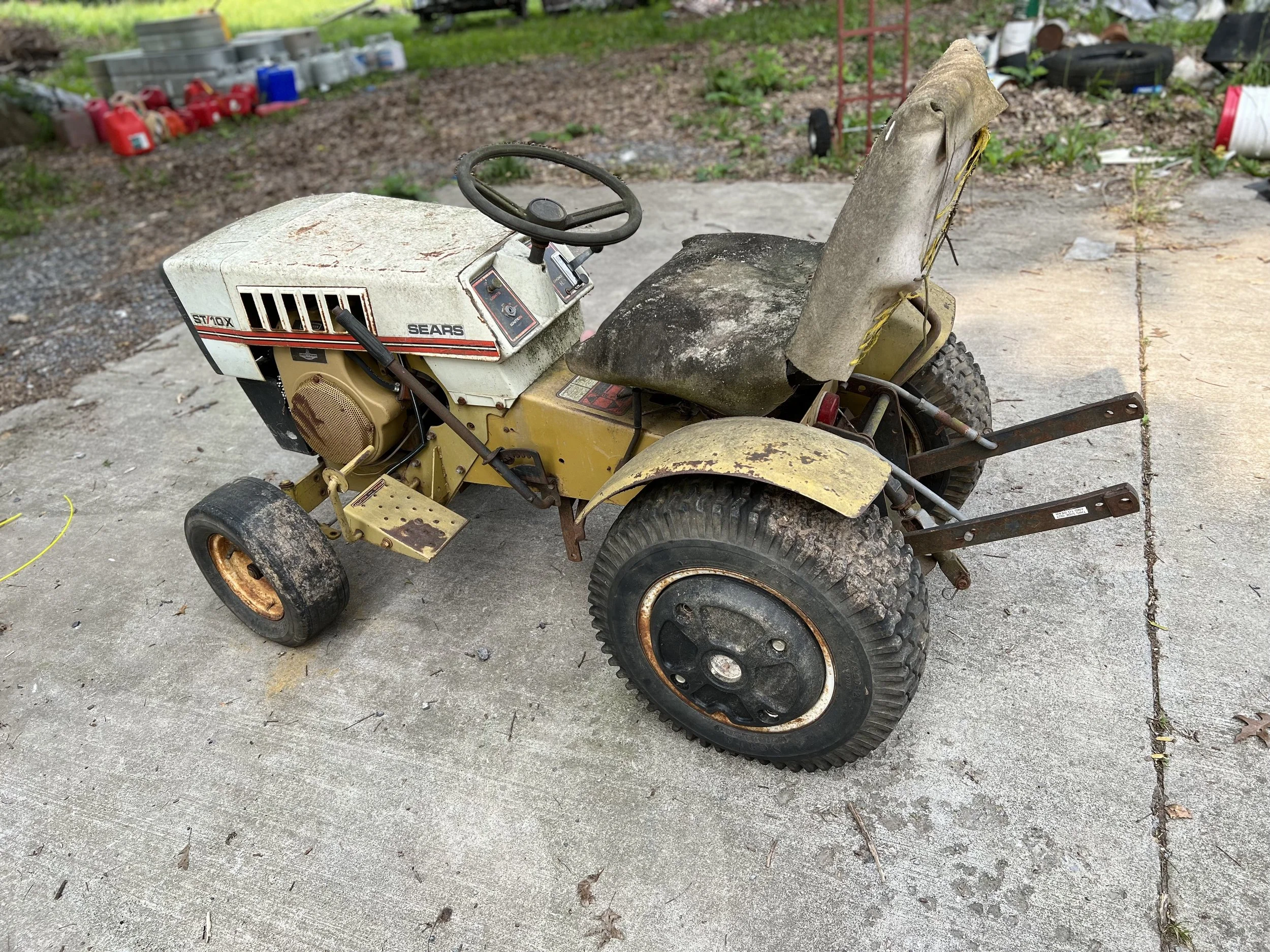 She Contemplates the Seductiveness of My Motorized Farming Machine