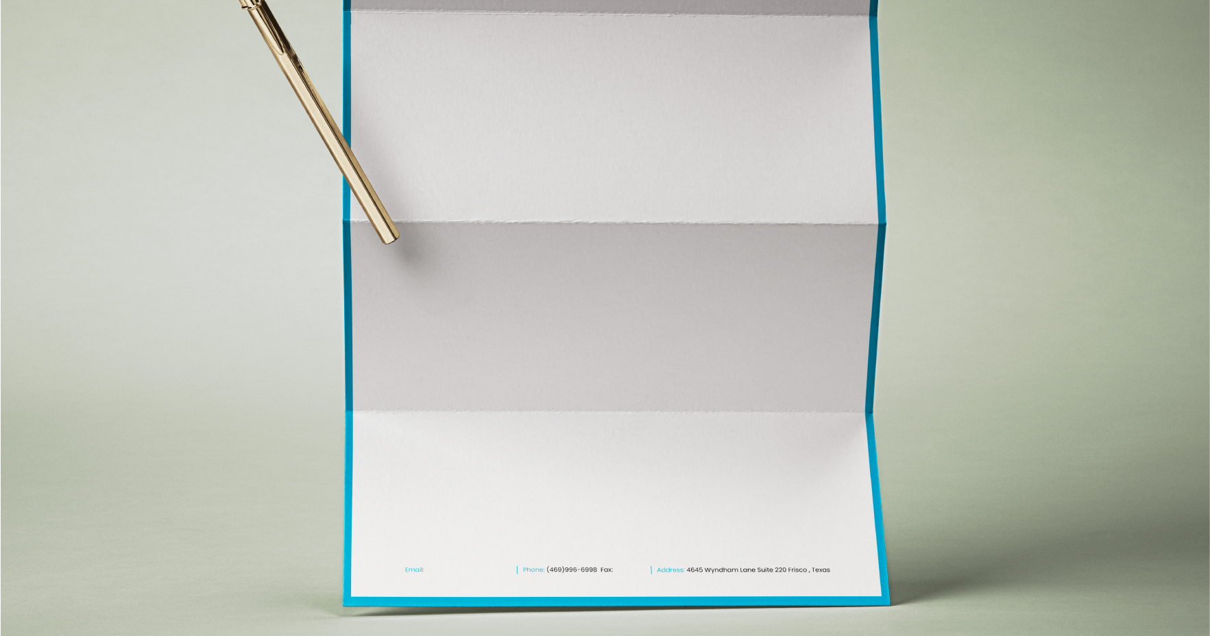 Open blue box with white interior and blue trim, with a gold pen resting on the surface. The bottom of the box shows contact information including email, phone number, fax, and address.
