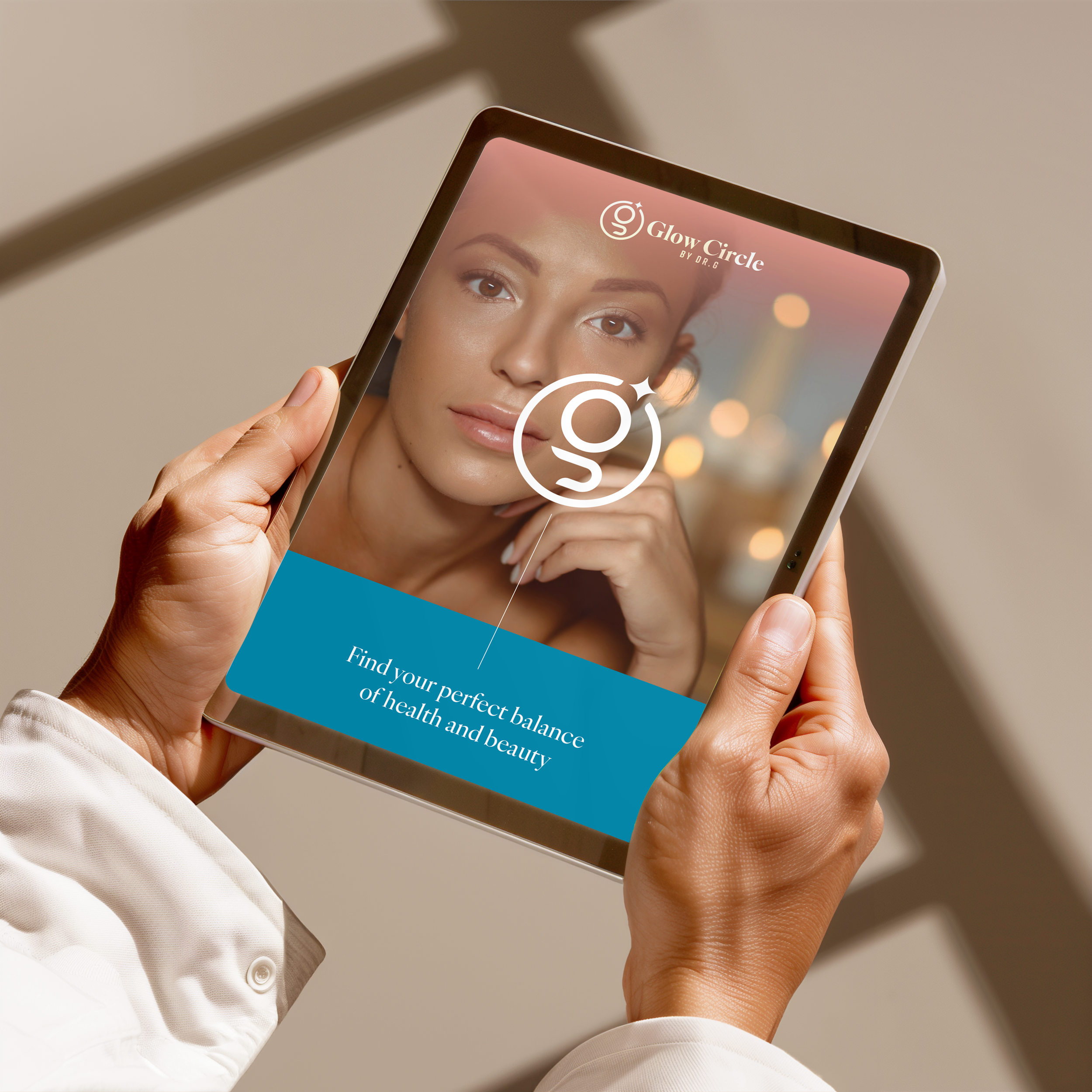Person holding a tablet with an image of a woman with smooth skin and the text 'Glow Circle by Dr. G' and 'Find your perfect balance of health and beauty' displayed on the screen.