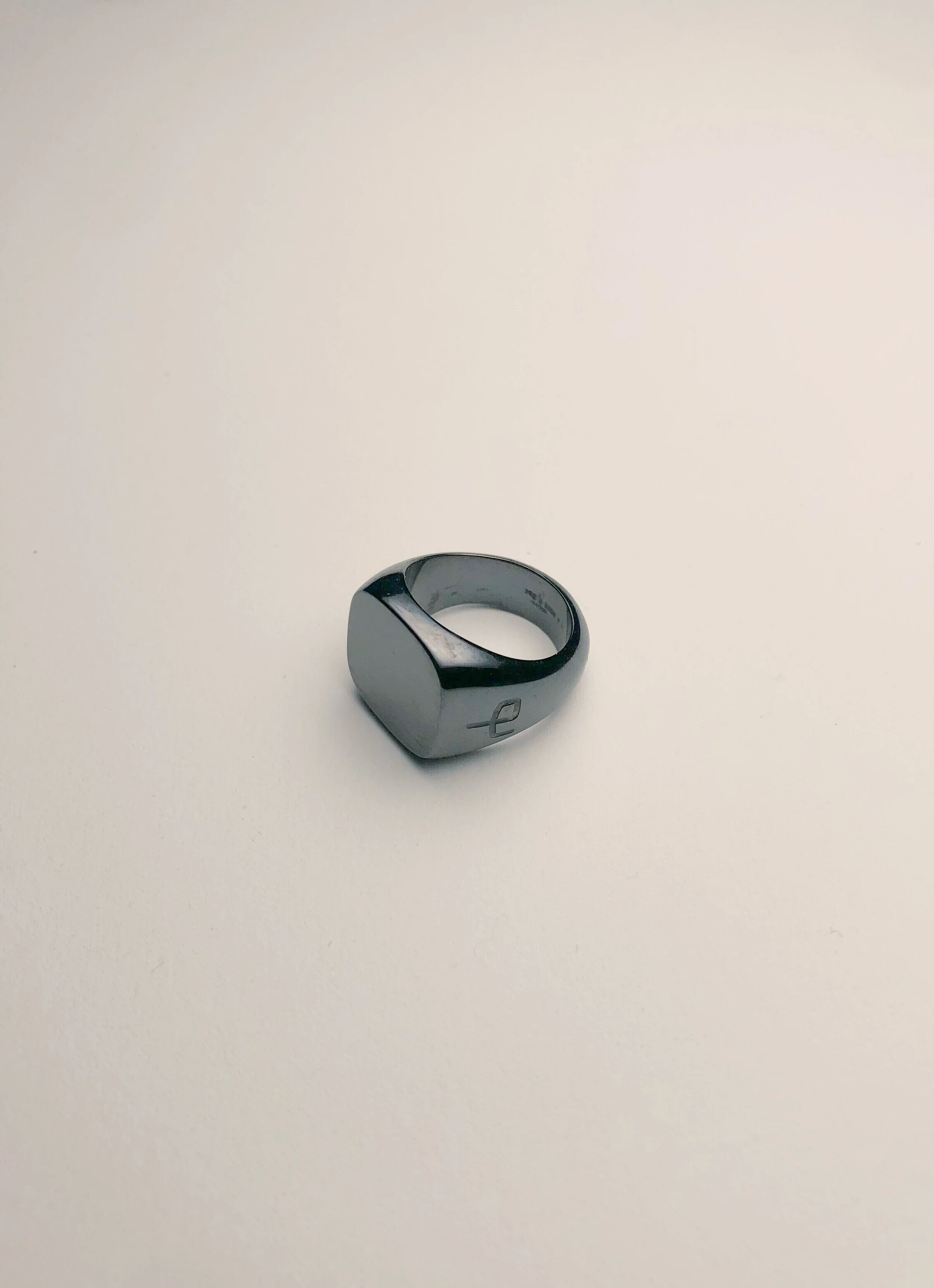 Titanium signet ring from Rag and Bone shown from the left.