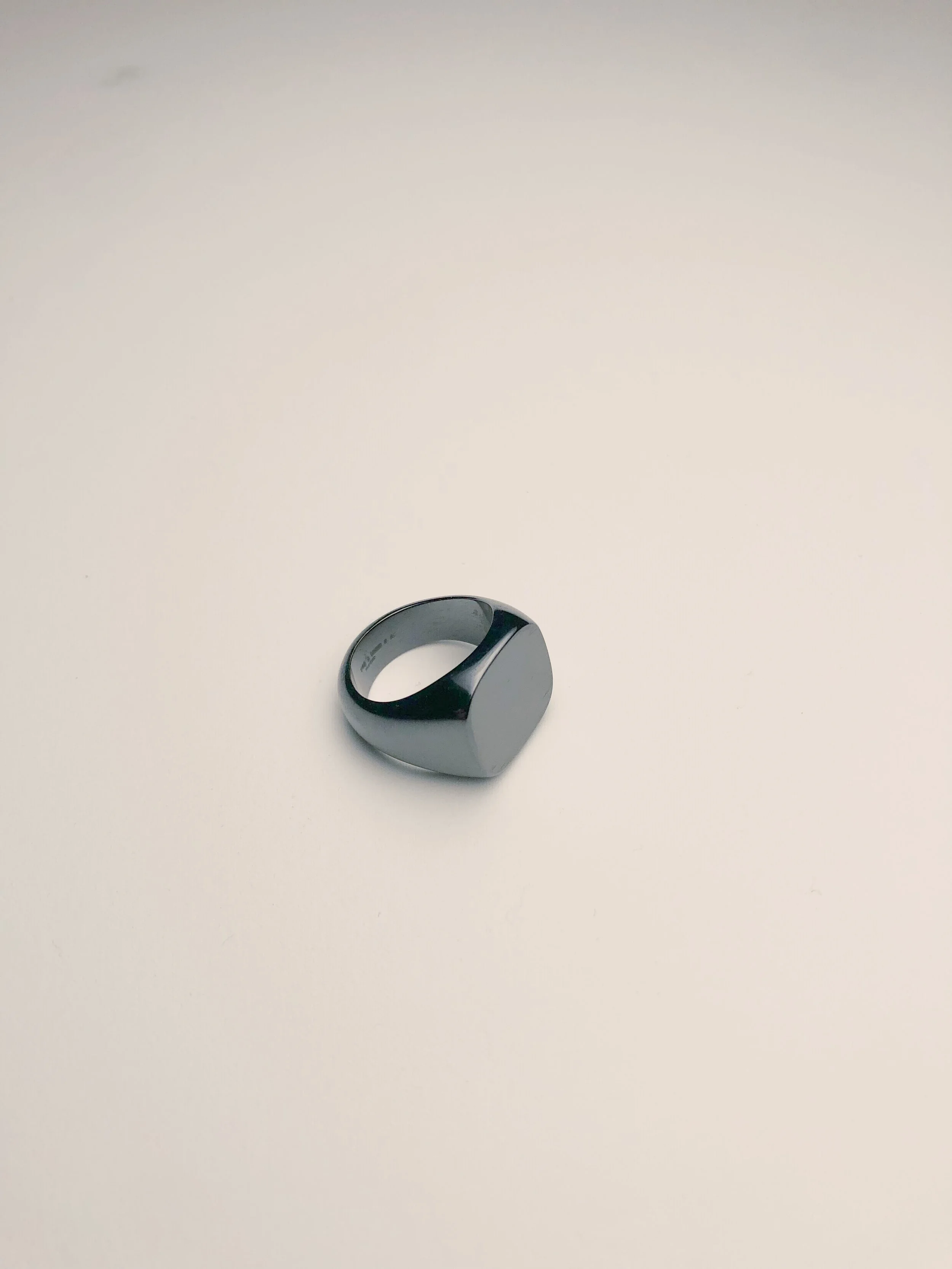 Titanium signet ring from Rag and Bone shown from the right.