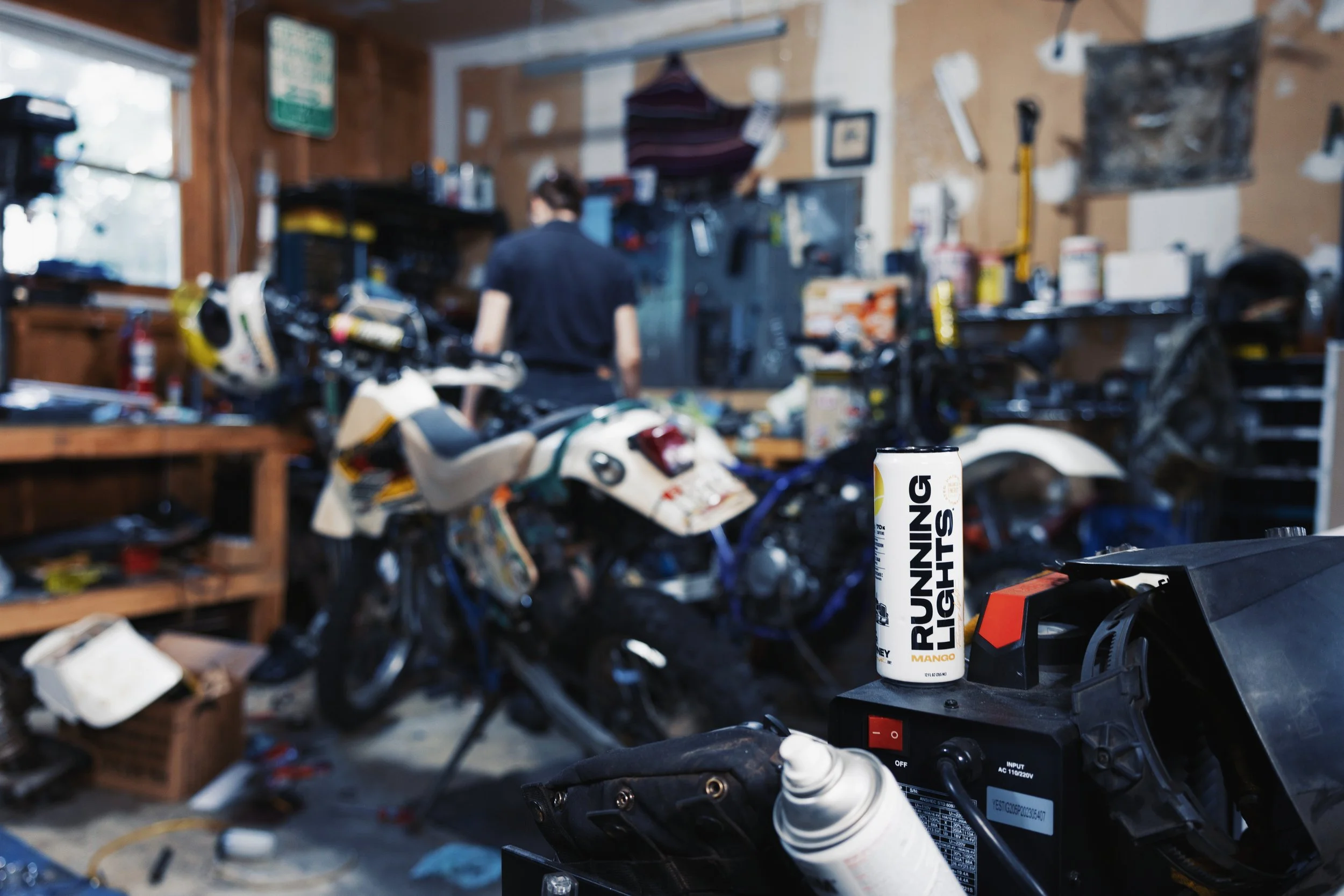 Running Lights Beverage on a welder in a motorcycle shop