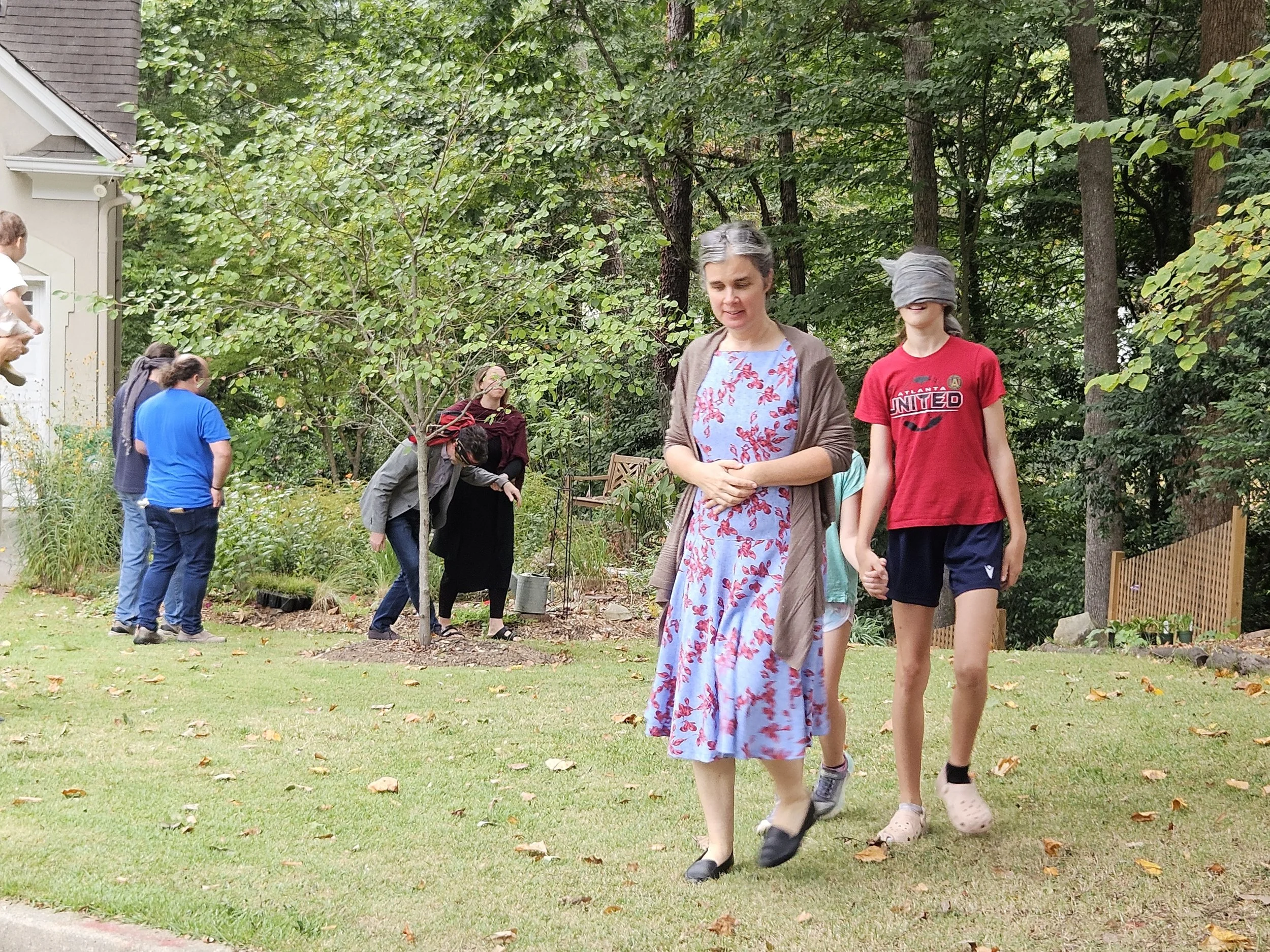 Courage challenge: Kate leads the group on a blindfold walk