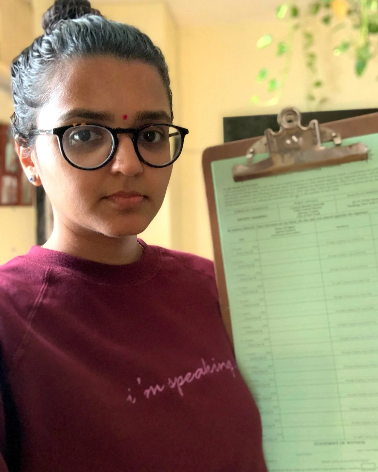 south-asian-female-activist-holding-clipboard