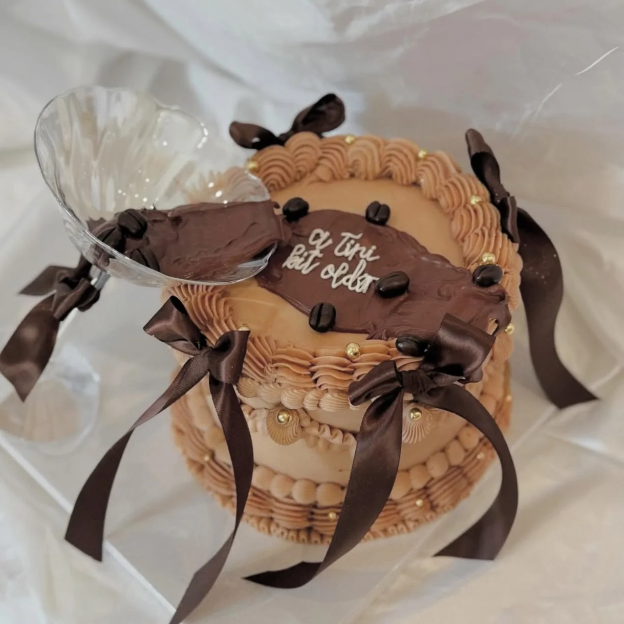 THURSDAY THROWBACK 
☕️I can not espresso how much I loved this cake ☕️

Custom vanilla cake filled with brown sugar chocolate ganache. 

Why are there 3 beans in an espresso martini? 

The stand for health, wealth &amp; happiness 

🤎ORDER NOW LINK I