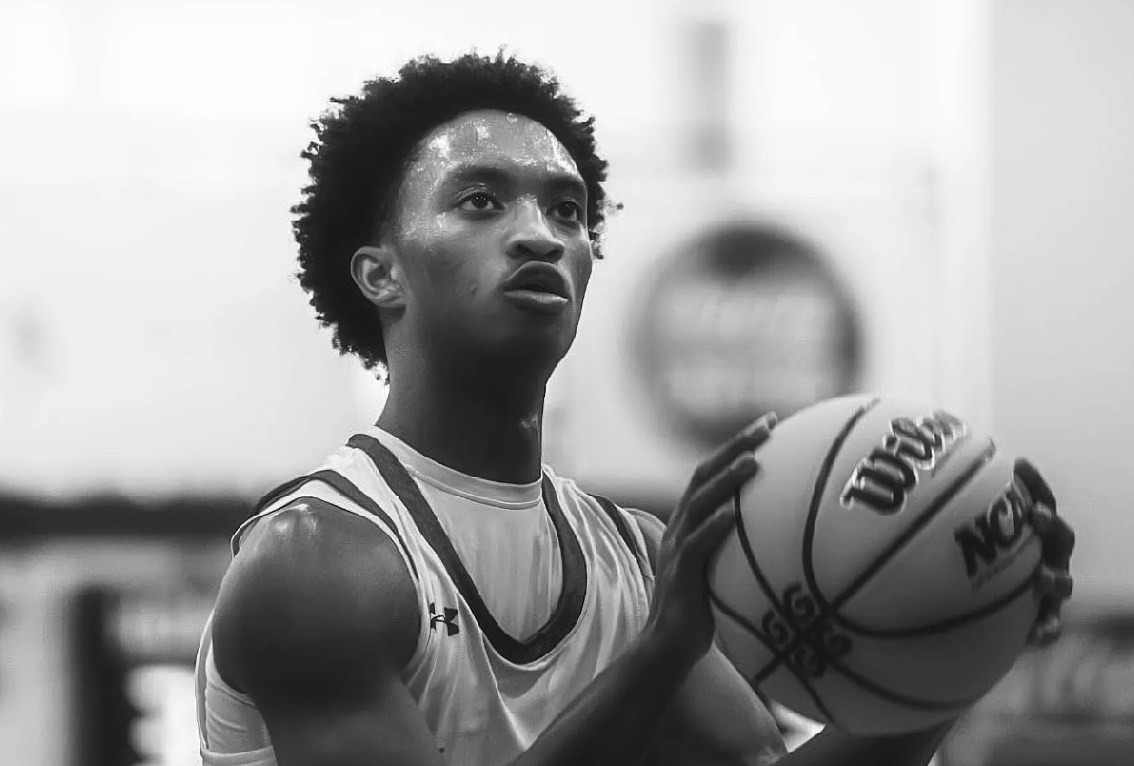 Photo of Nolan Wells with a basketball