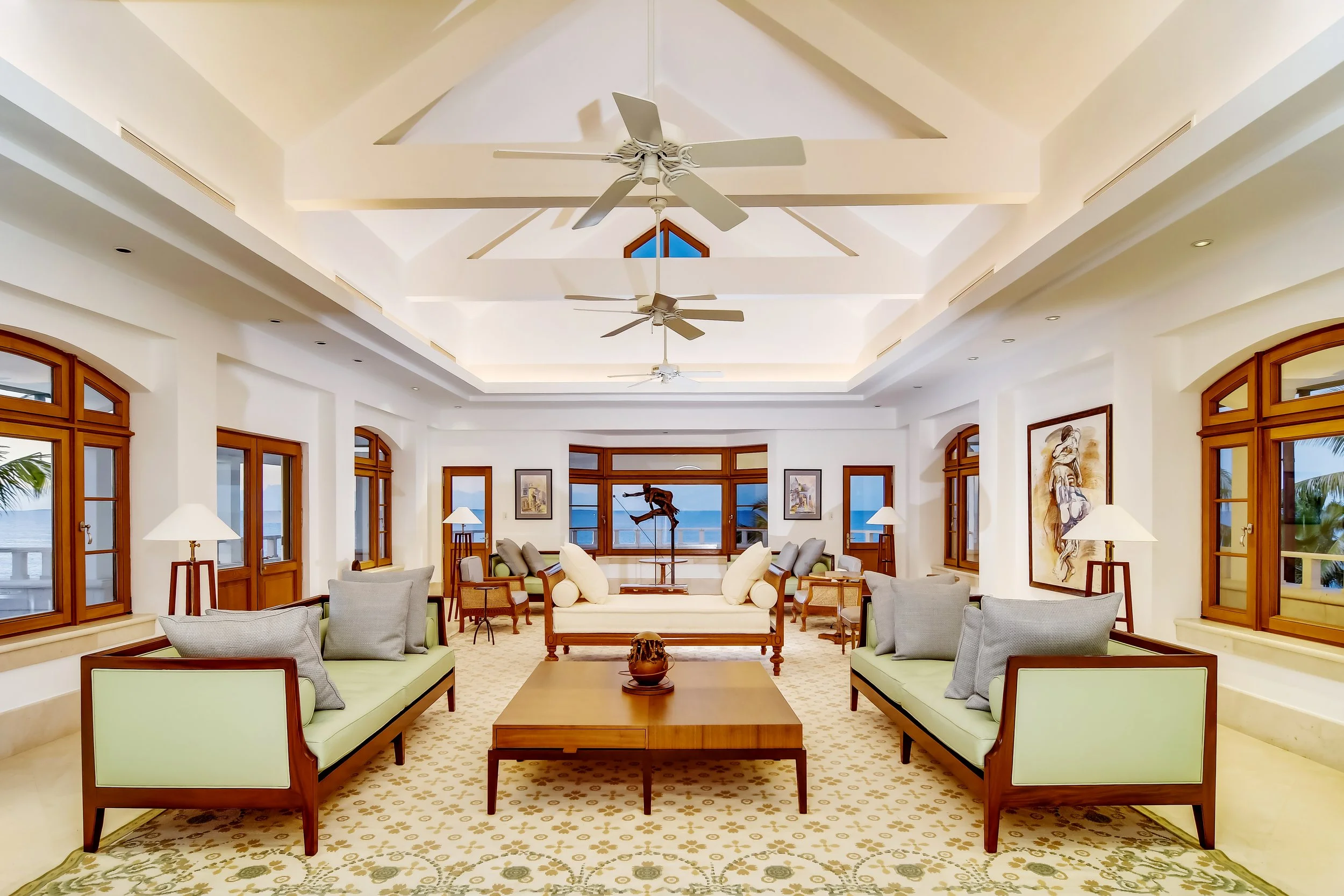Ocean View Hotel Villa Living Room with Desk and Palm Trees 