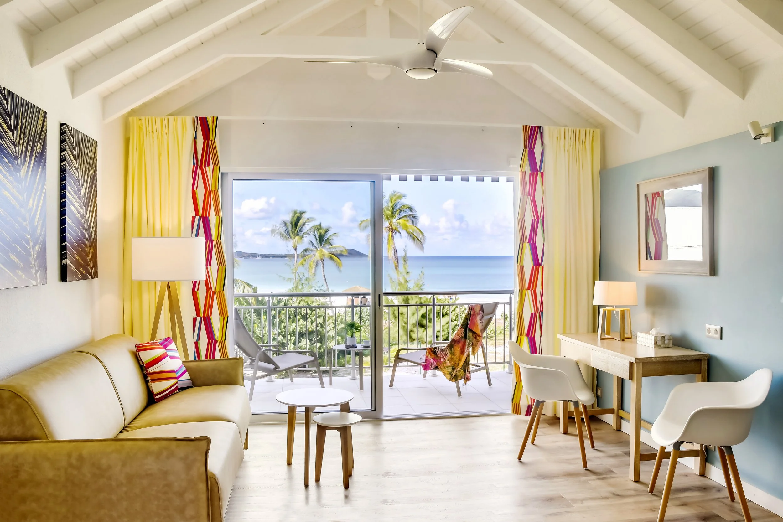 Ocean View Hotel Living Room with Desk and Palm Trees 