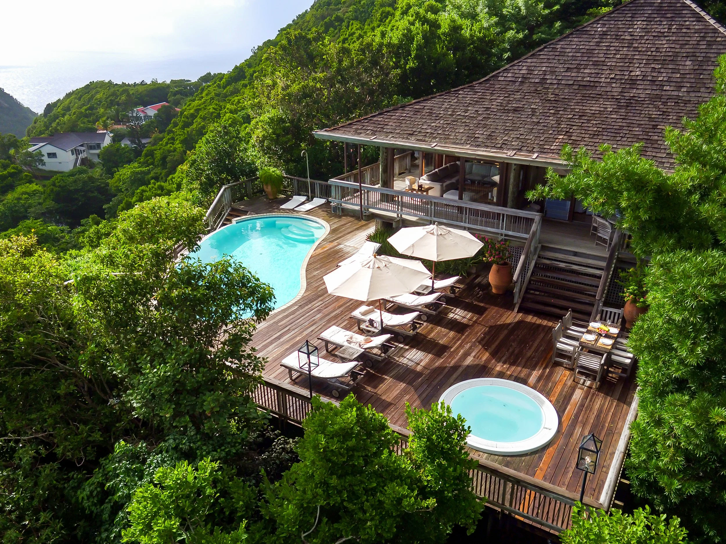 Topical Home Deck with Hot Tub and  Pool over looking the mountains 