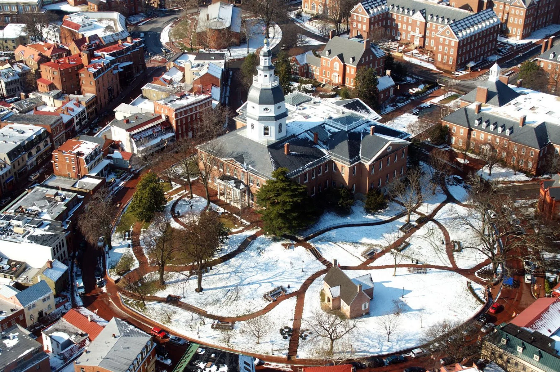 Aerial of Small town square with snowfall 