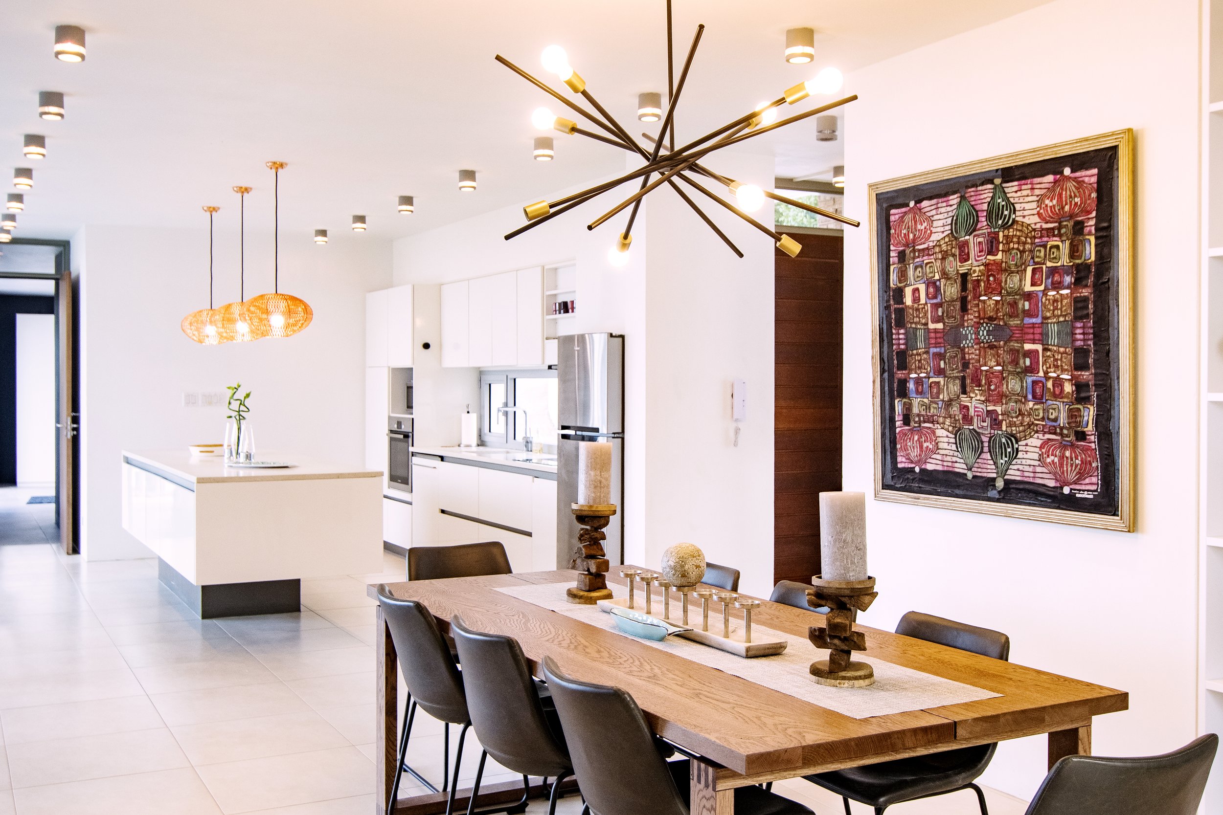 Interior modern kitchen and dining room with chandelier 