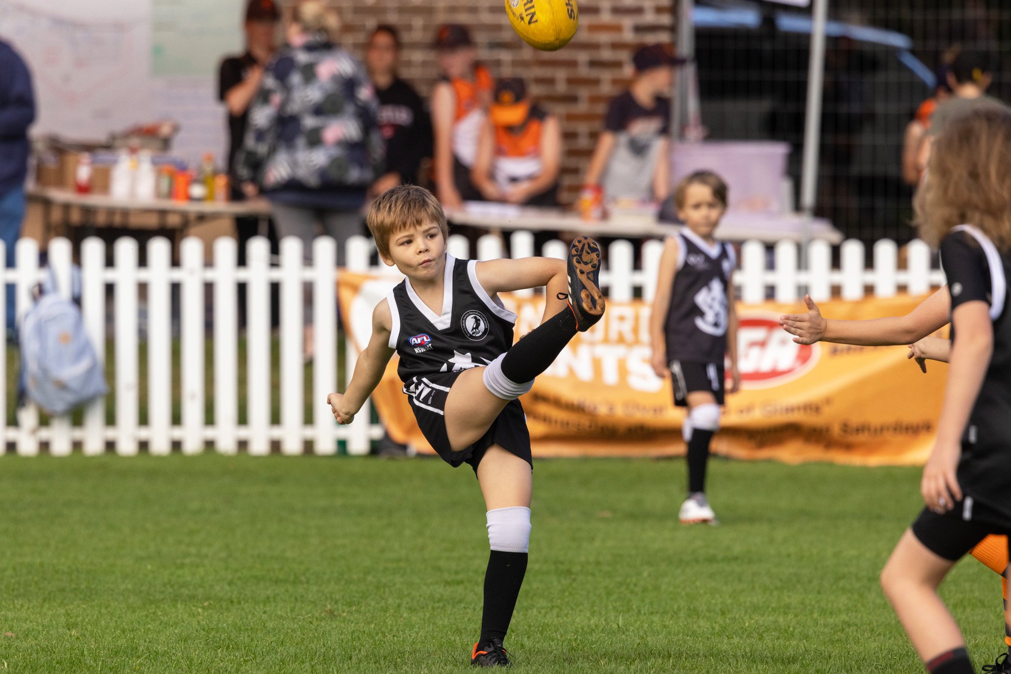 Inner-West-Magpies-Auskick-young-boy-kicking-ball.jpg