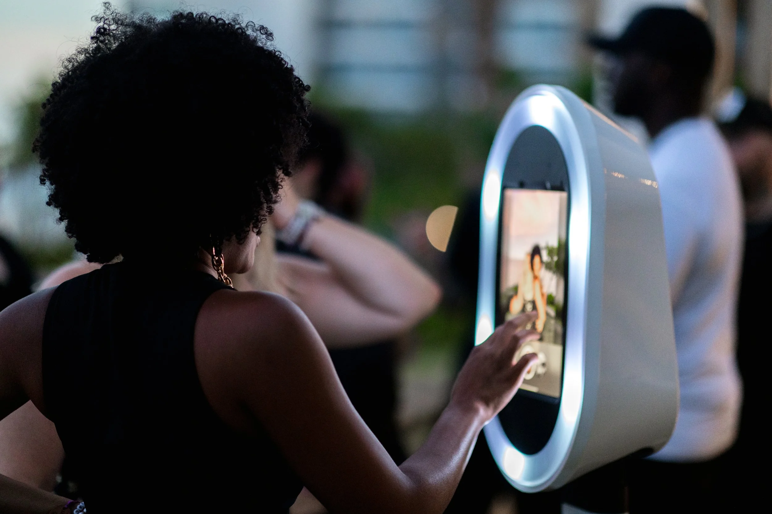 Guests using Opto Booth Go slow motion mode at a Los Cabos event