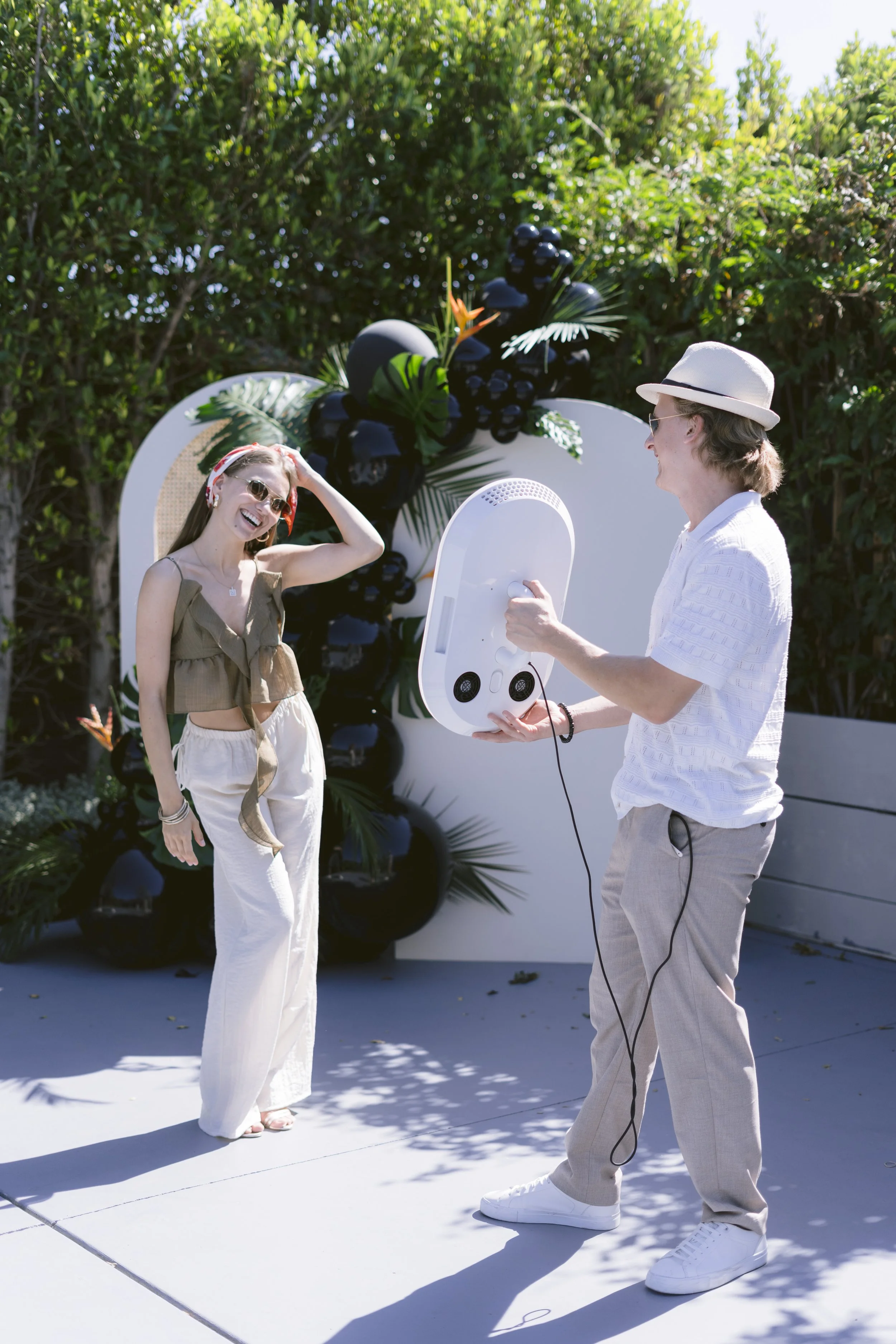 Couple using Opto Booth Go at an outdoor destination wedding in Los Cabos