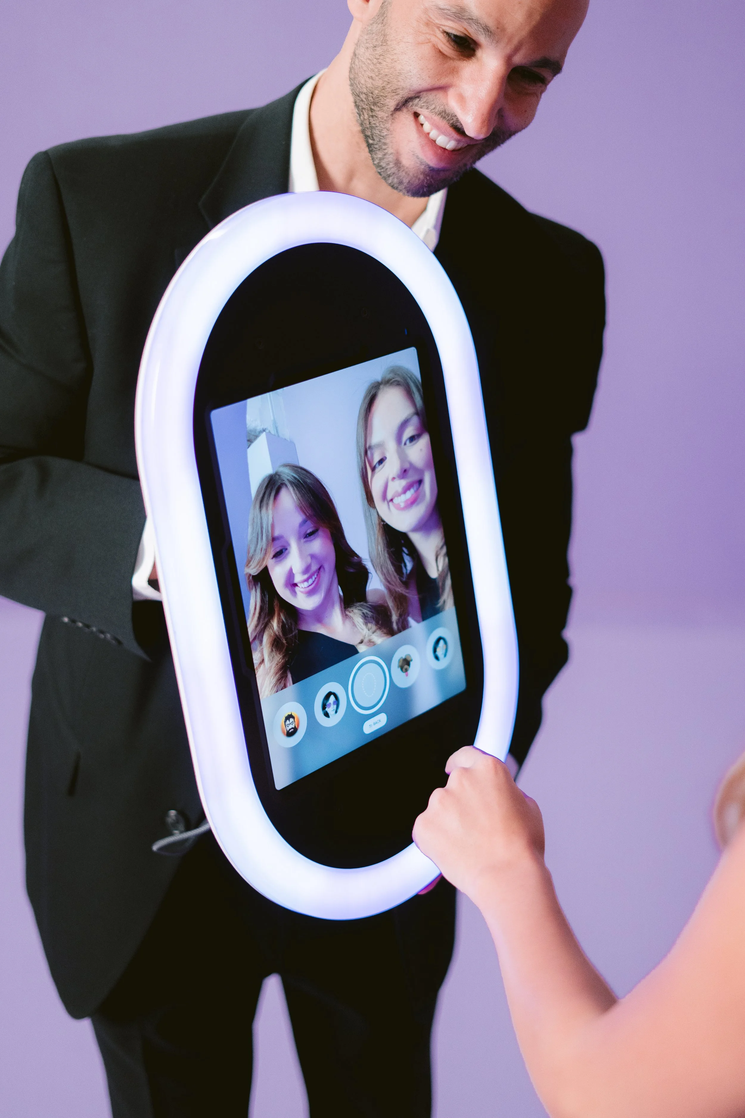 Guests viewing their photos on the Opto Booth Go touchscreen