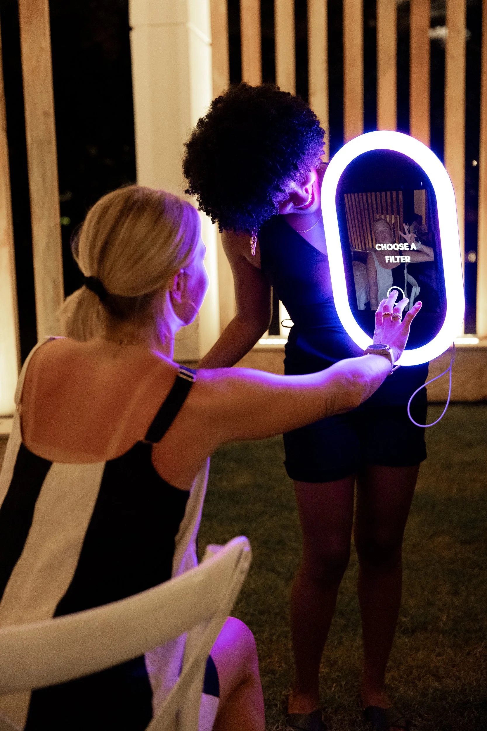 Close-up of a guest interacting with the Opto Booth Go touchscreen