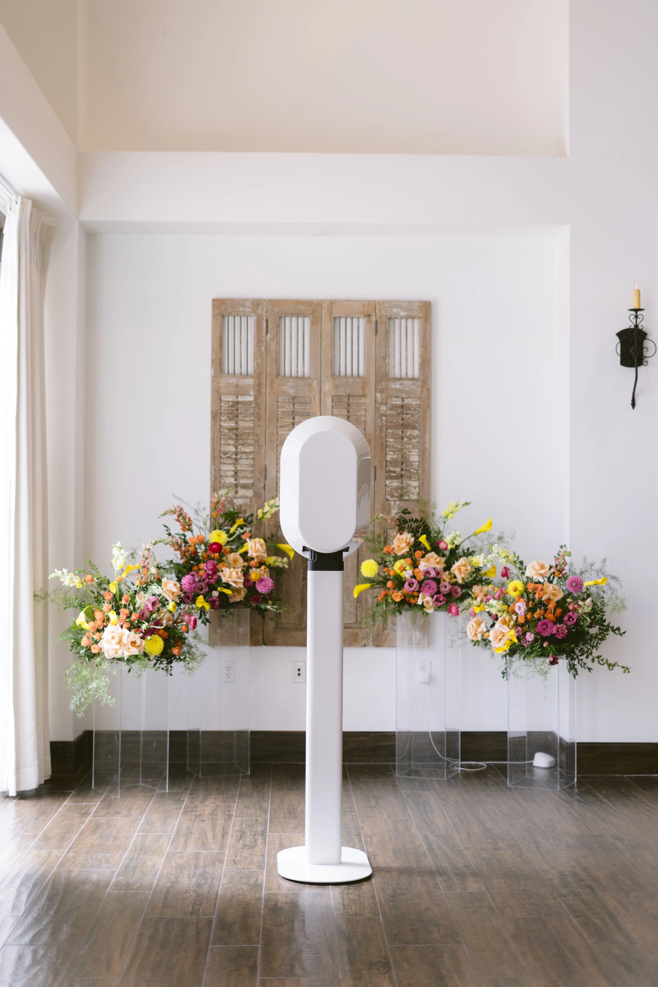 Opto Booth Go photo booth placed within a refined wedding reception setup