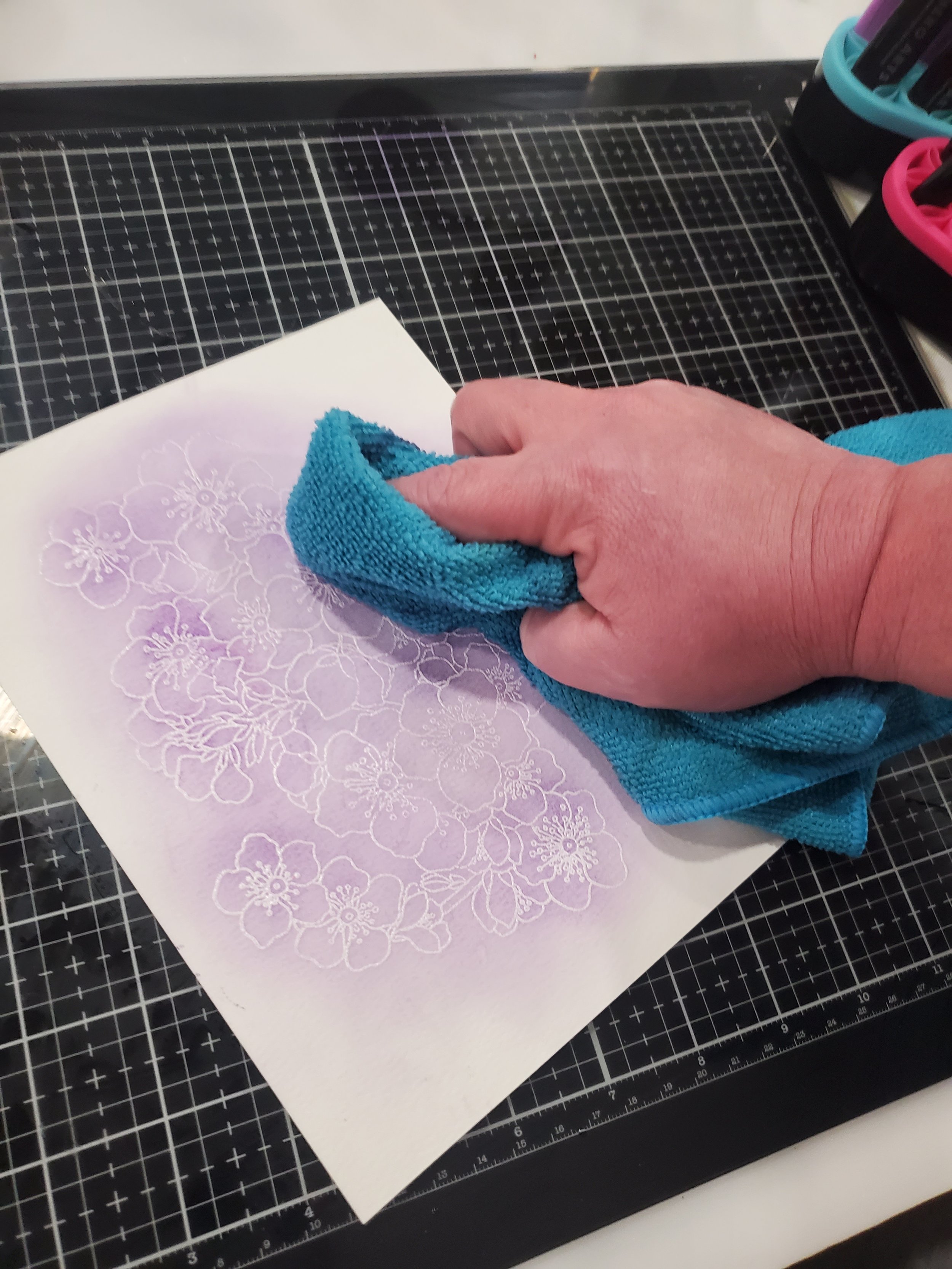 Wipe off excess ink from embossing