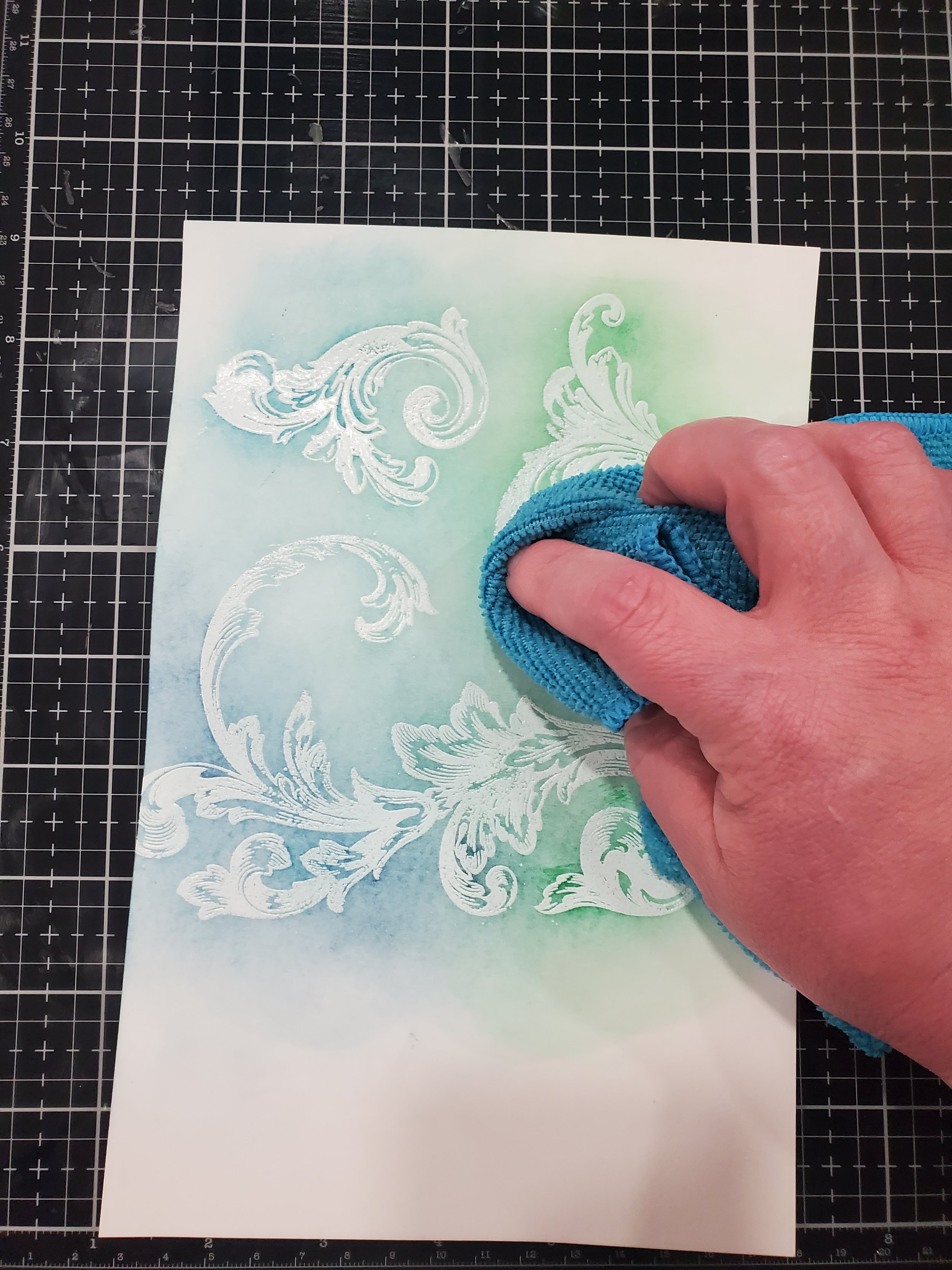 Remove excess ink from embossing powder