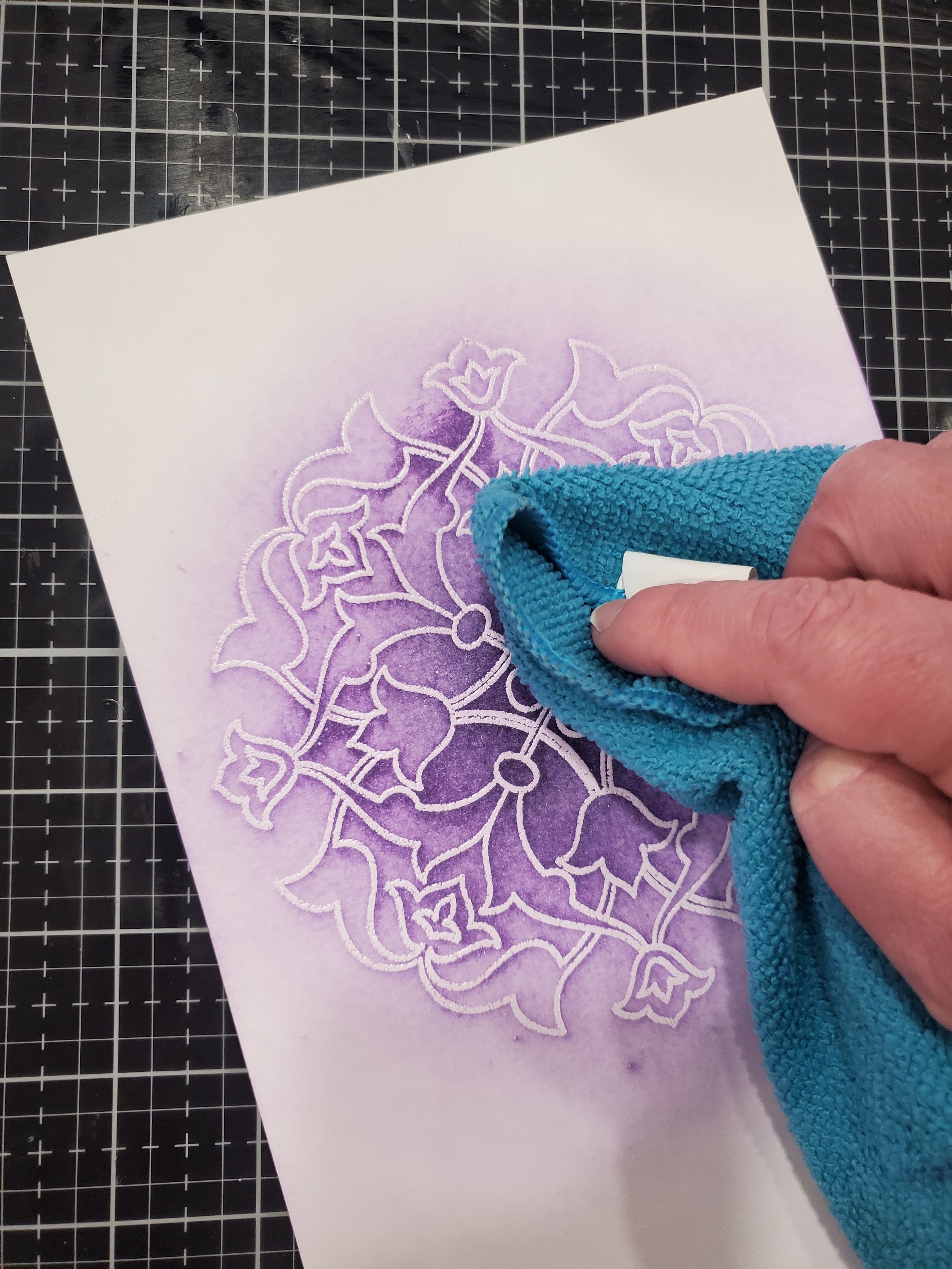 Remove excess from embossing powder