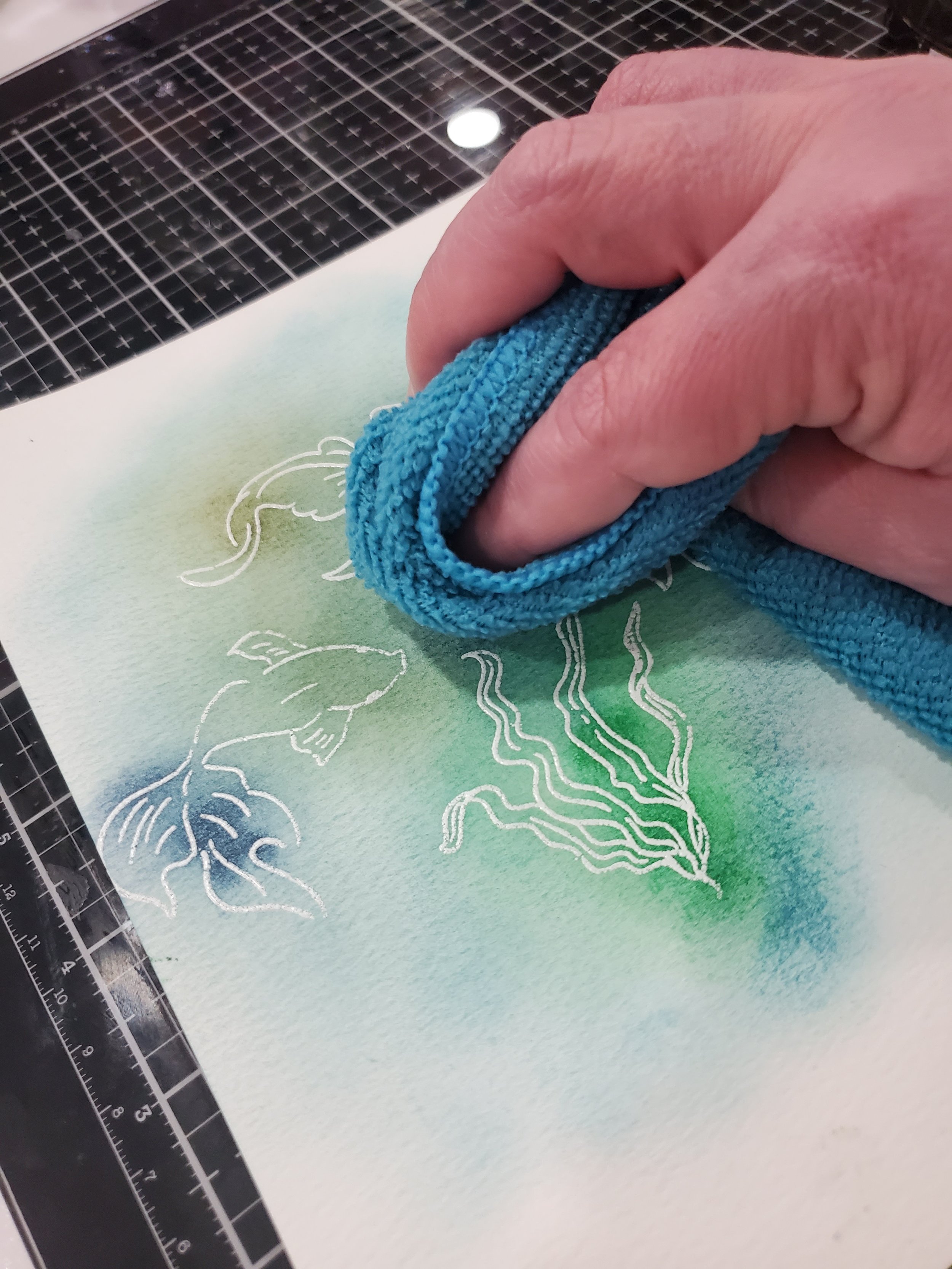 Remove excess ink from embossing powder