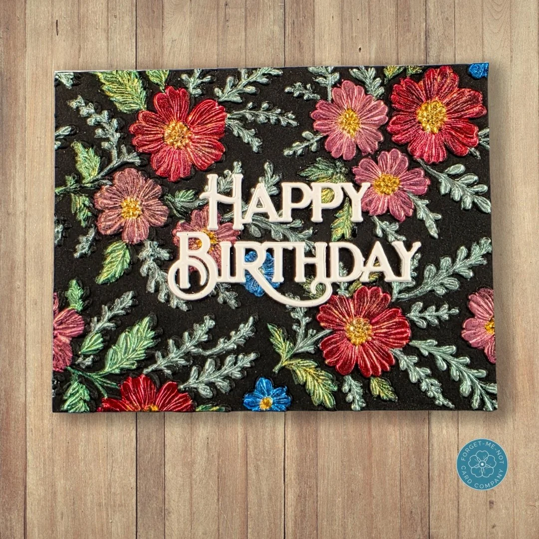 Good day, fellow crafters! Today, I wanted to share this card that I put together with a stunning 3D embossed floral design. I decided to feature a colorful, vibrant mix of botanical details that pop against a dark background, and for contrast, an ey