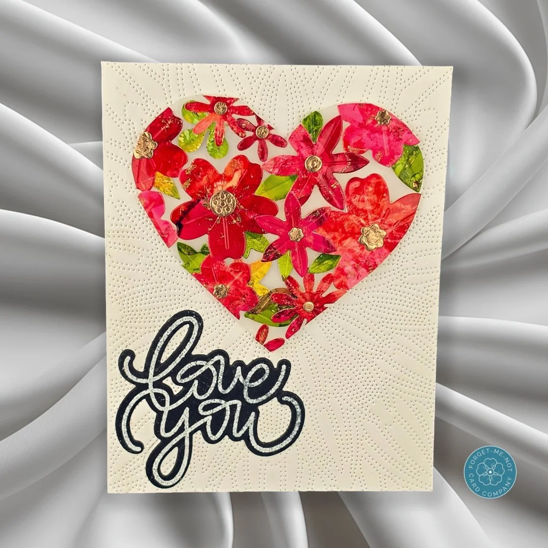 Good day, fellow crafters. This vibrant handmade "Love You" greeting card features a stunning heart window filled with hand-layered floral die-cuts and shimmering gold details to send a message straight from the heart. ❤️🌸 This design was 