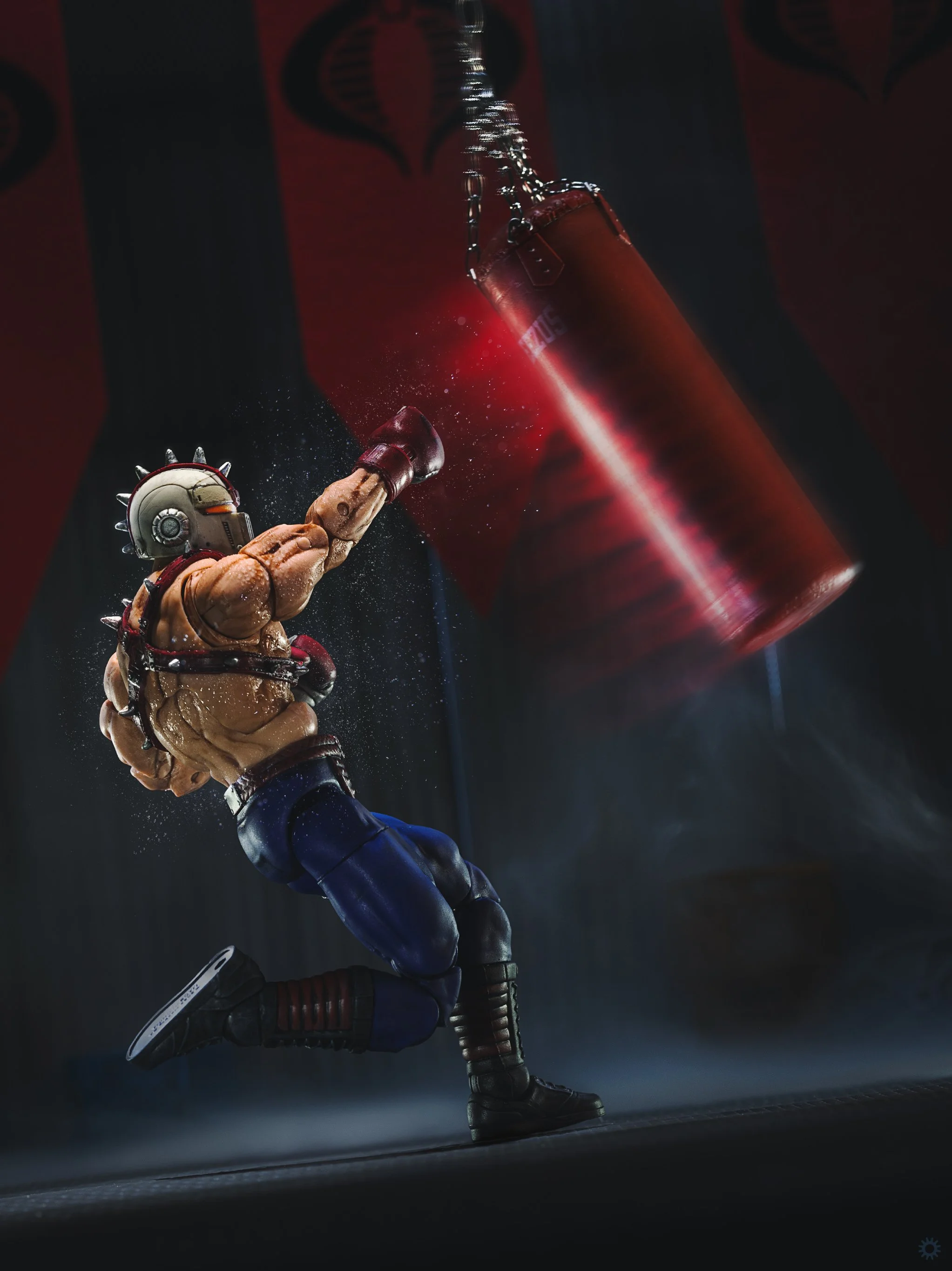 G.I. Joe Classified Big Boa punching a heavy bag in a Cobra Terror Drome training facility on Cobra Island