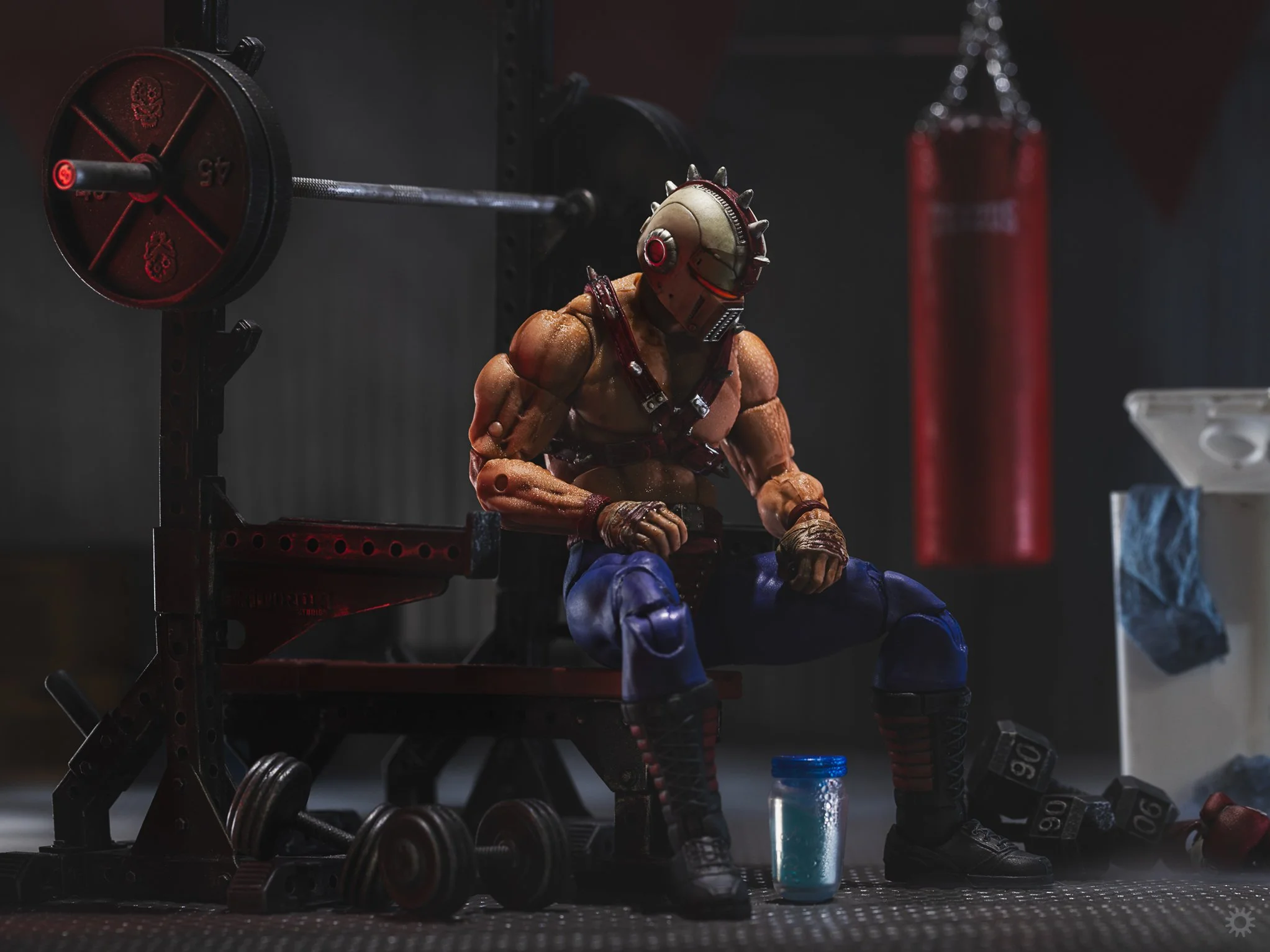 G.I. Joe Classified Big Boa sitting on a weightlifting bench in a Cobra Terror Drome training facility on Cobra Island