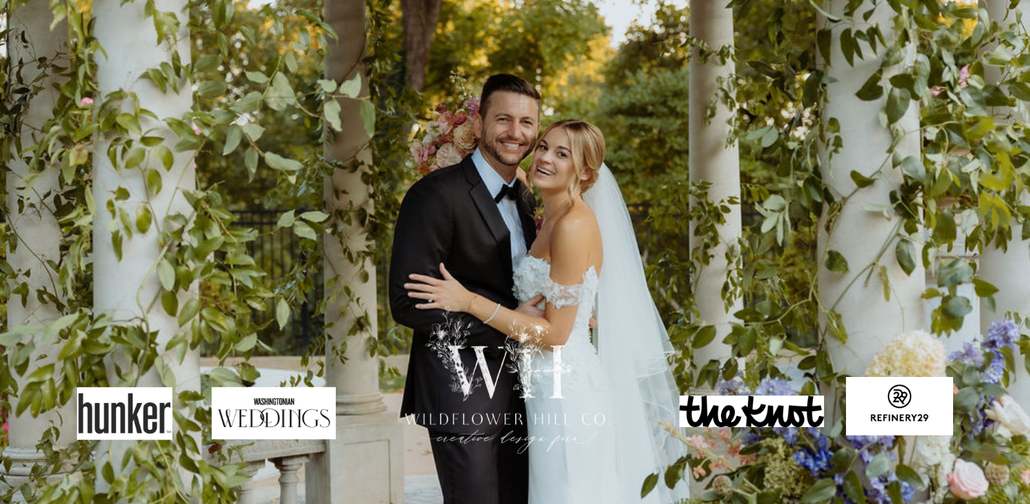 Bride and groom beneath a floral installation by Wildflower Hill Co., full-service wedding florist in Northern Virginia and Washington, DC.