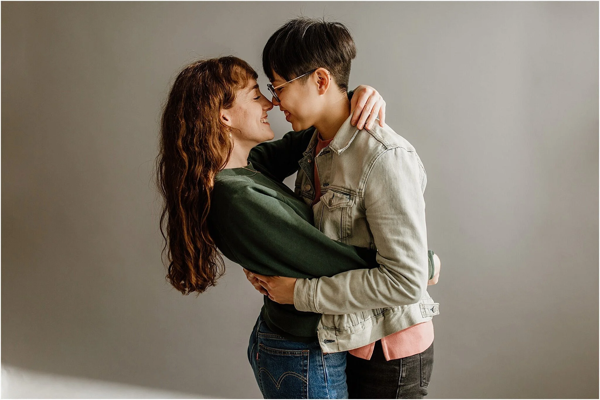 same sex couple embracing studio photo vancouver bc