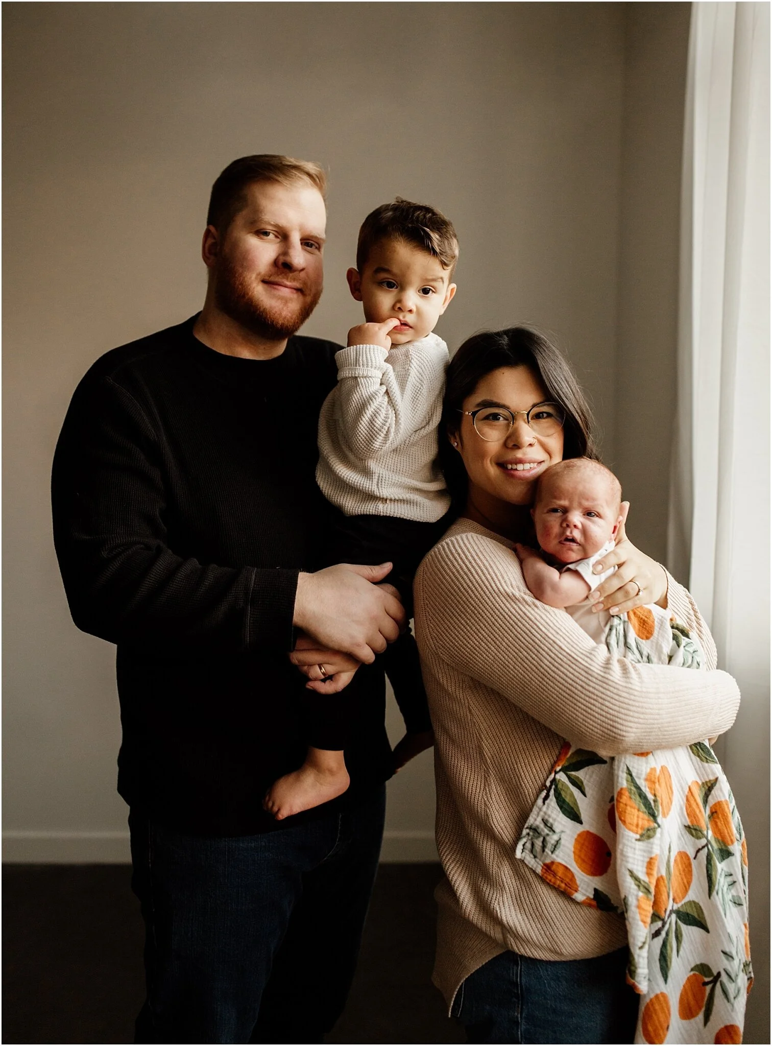 natural light studio portrait of family with two kids in vancouver
