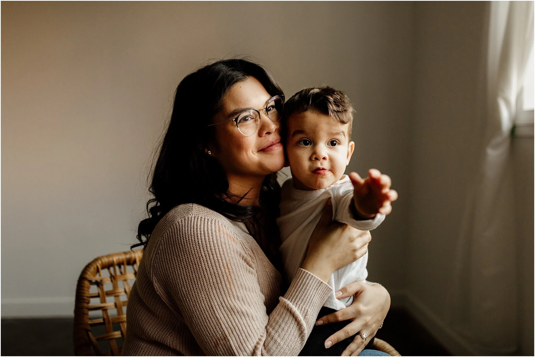 natural light studio portrait of mom holding toddler son