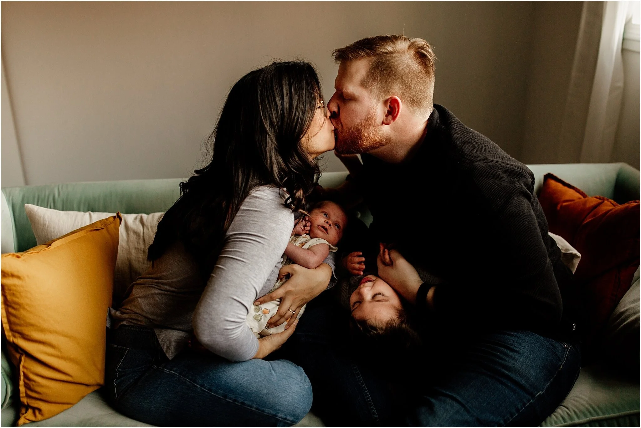 vancouver studio family portrait of mom and dad kissing