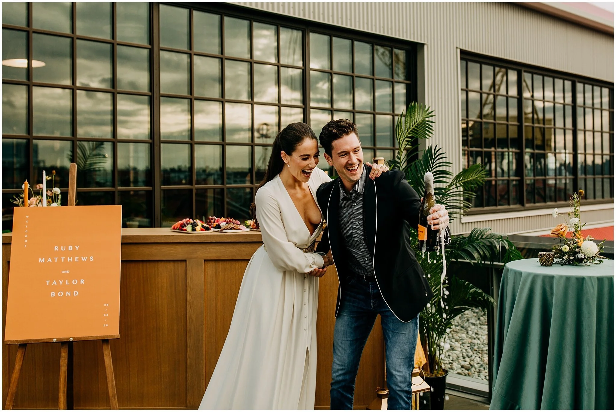 bride and groom popping champagne at rocky mountain bride styled shoot at the wallace