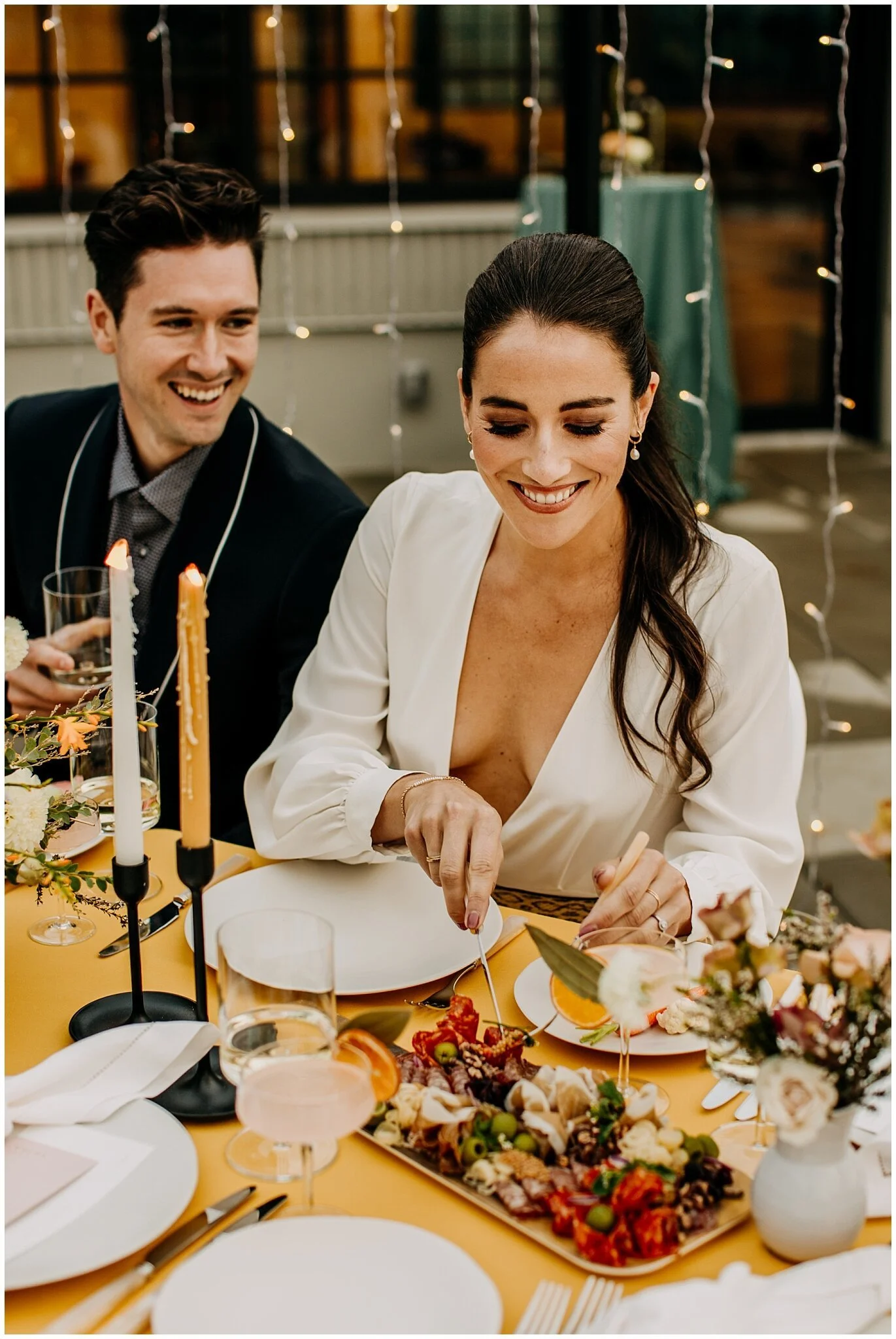 bride and groom eating hawksworth charcuterie board at the wallace