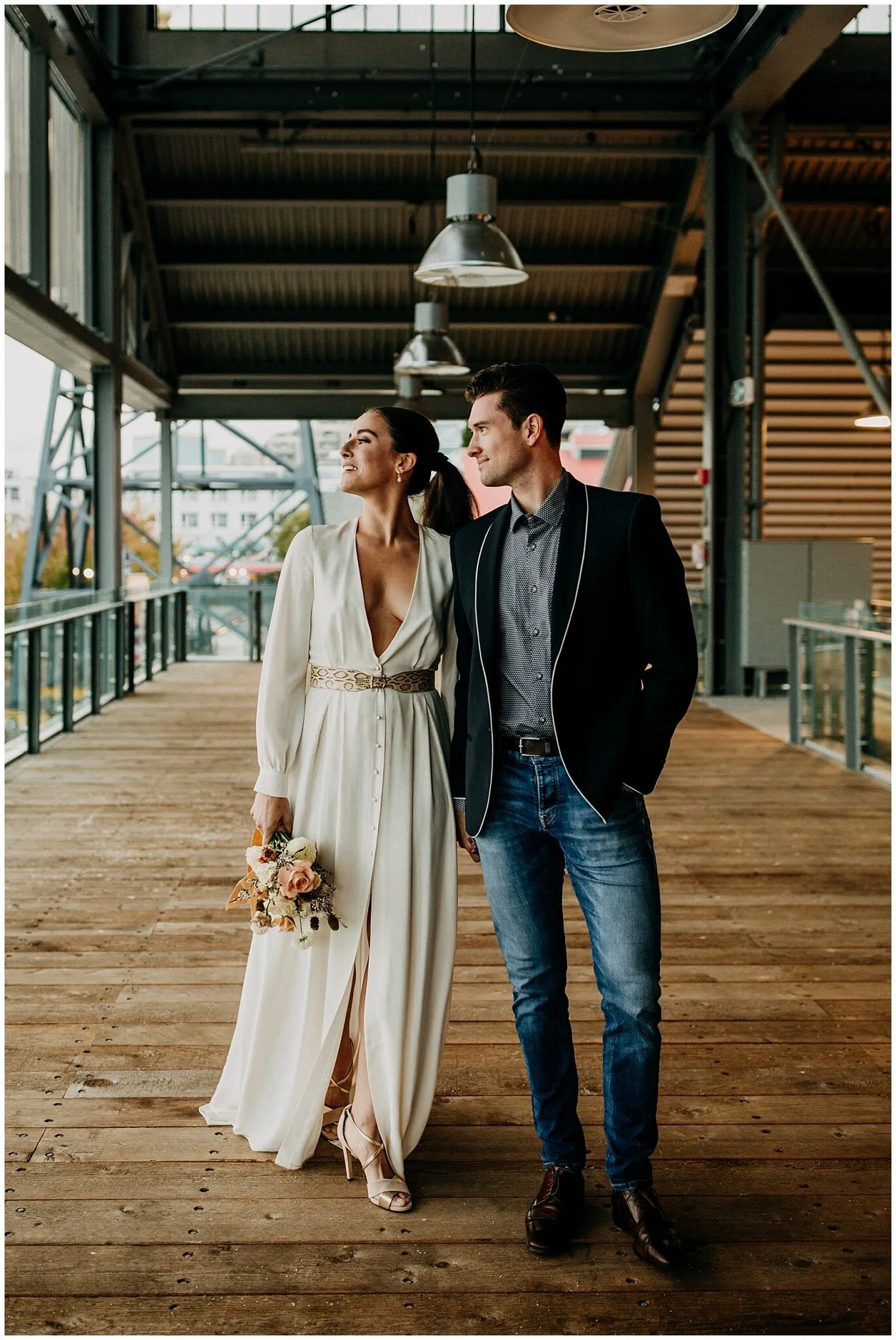 bride and groom walking along the wallace patio for rocky mountain bride