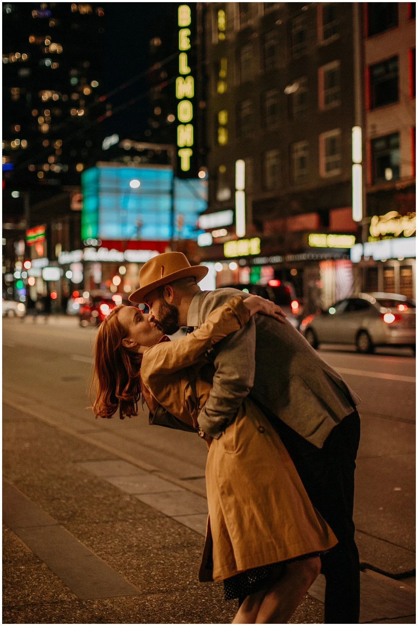 couple kissing on granville strip with neon lights