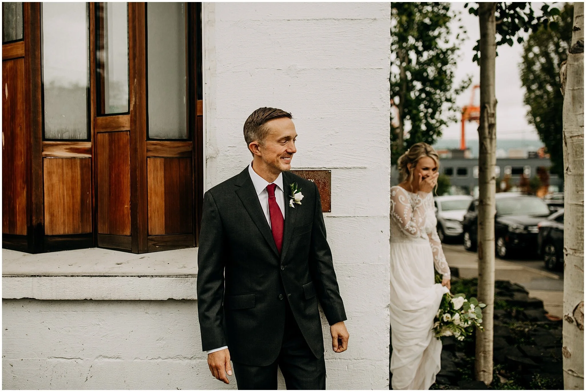 bride and groom first look no look at settlement building
