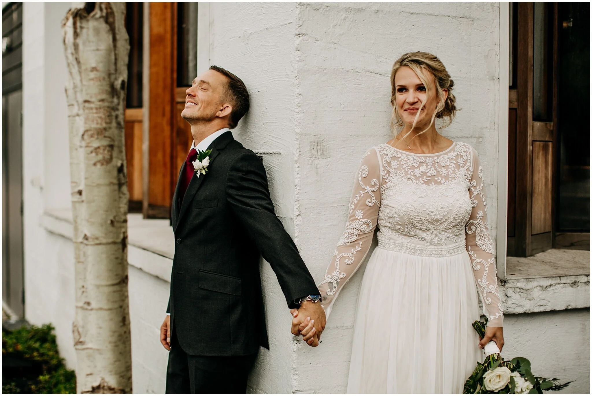 bride and groom first look no look at settlement building