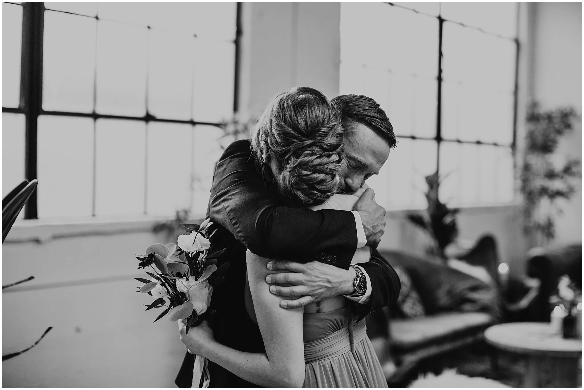 groom hugging daughter at settlement building ceremony 