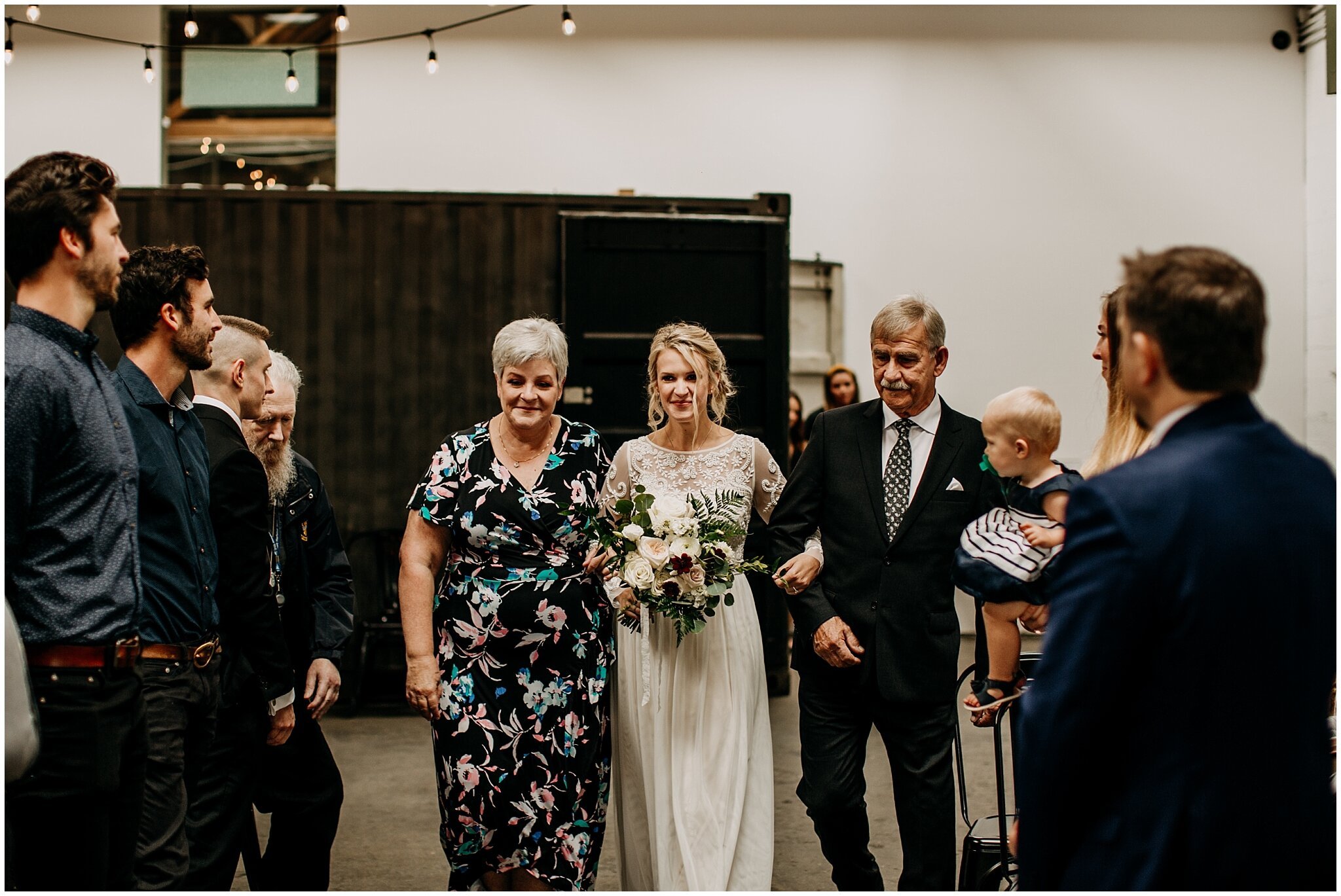 bride walking down aisle at settlement building wedding