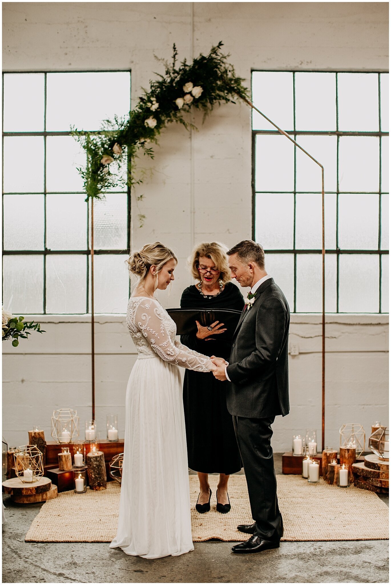 bride and groom at ceremony altar at settlement building wedding