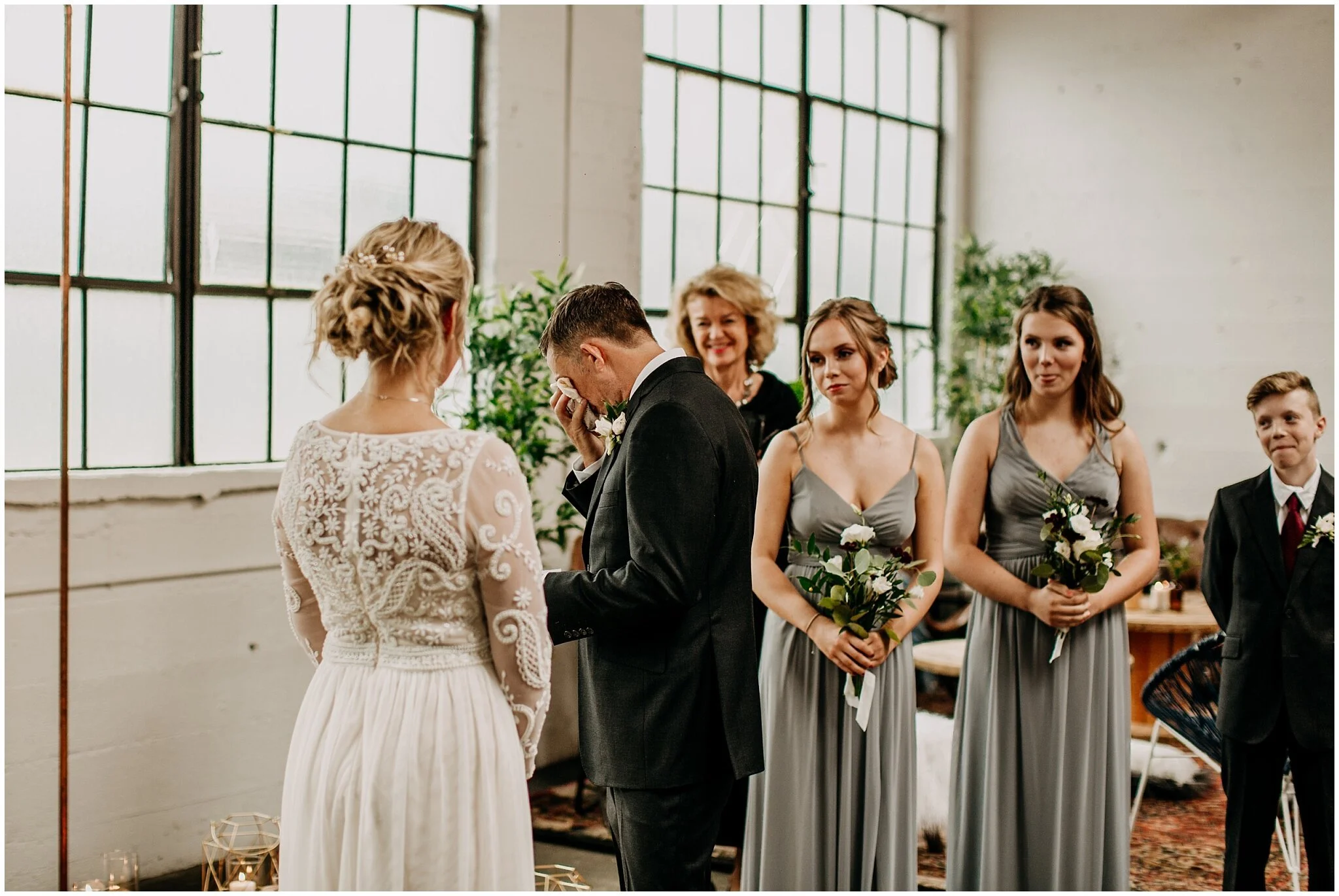 groom emotional during vows at settlement building wedding