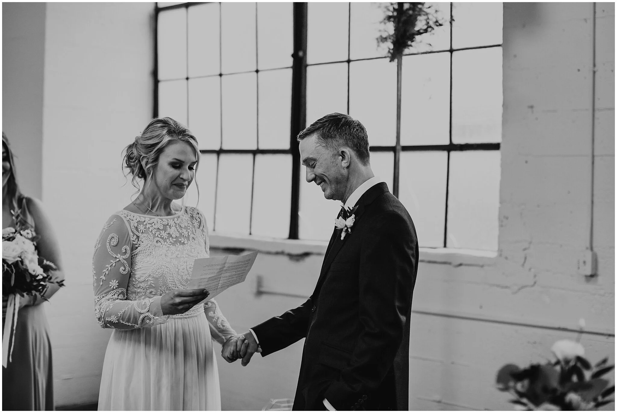 bride and groom exchanging vows at settlement building wedding
