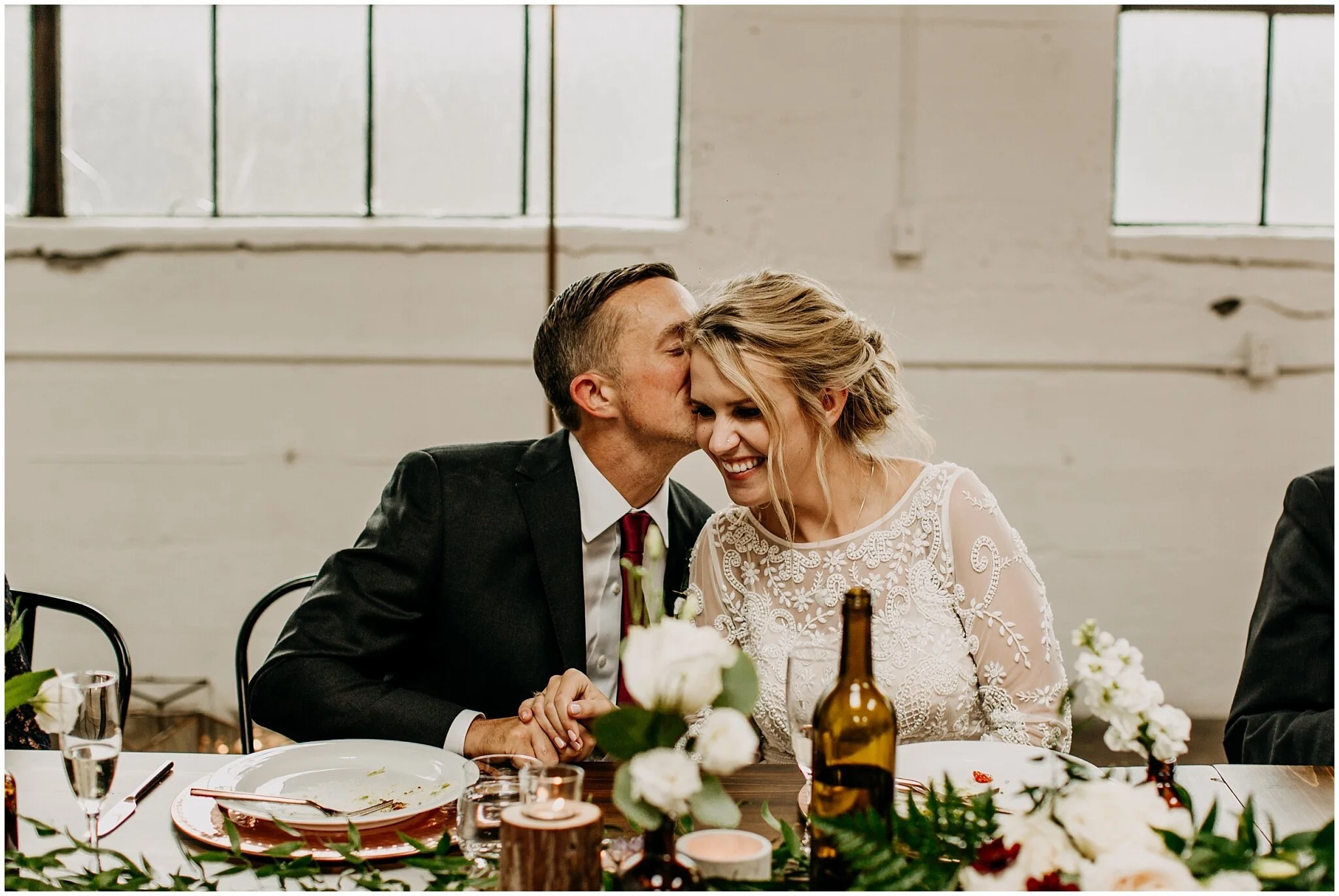bride and groom cute candid moment at settlement building wedding